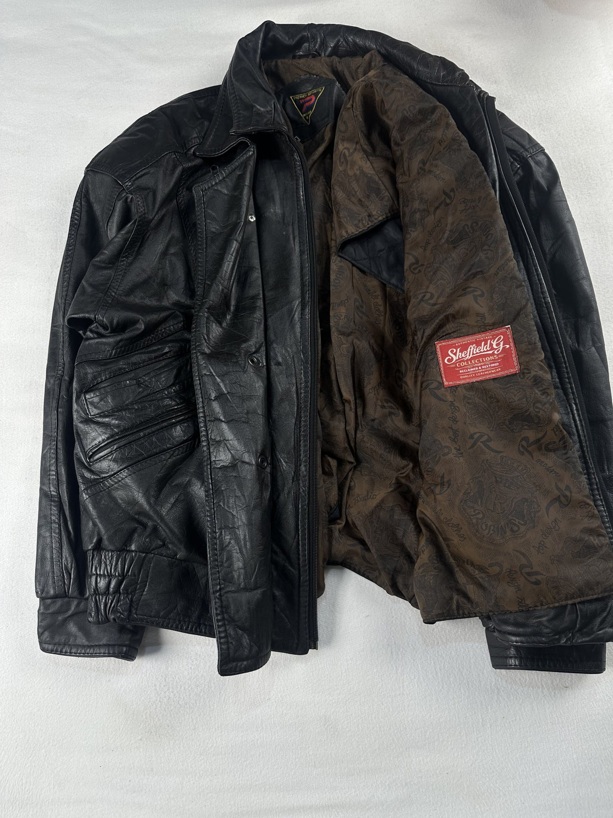 Black leather field jacket, size L - interior lining.