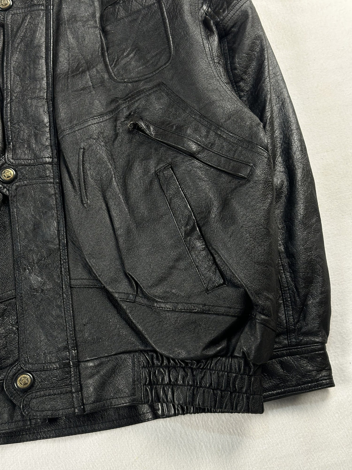 Black leather field jacket, size L - size and label context.