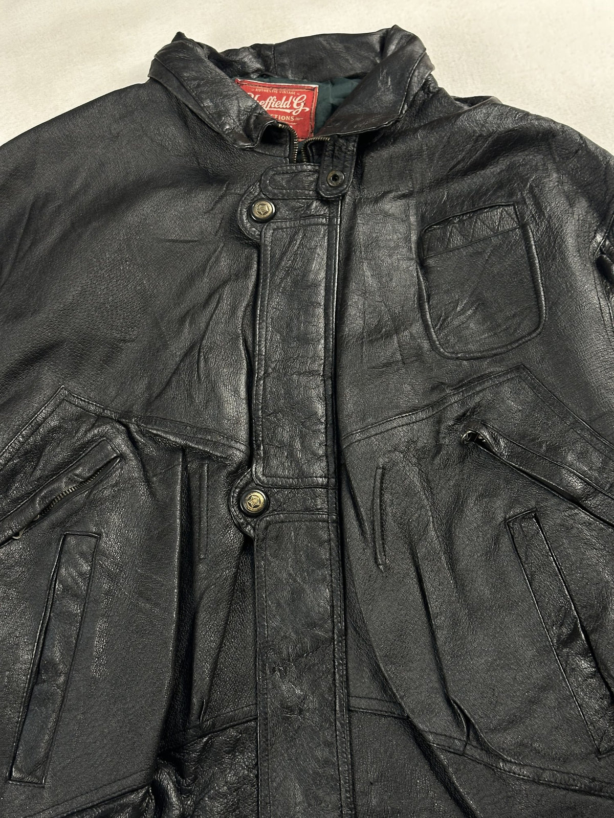 Black leather field jacket, size L - back view.