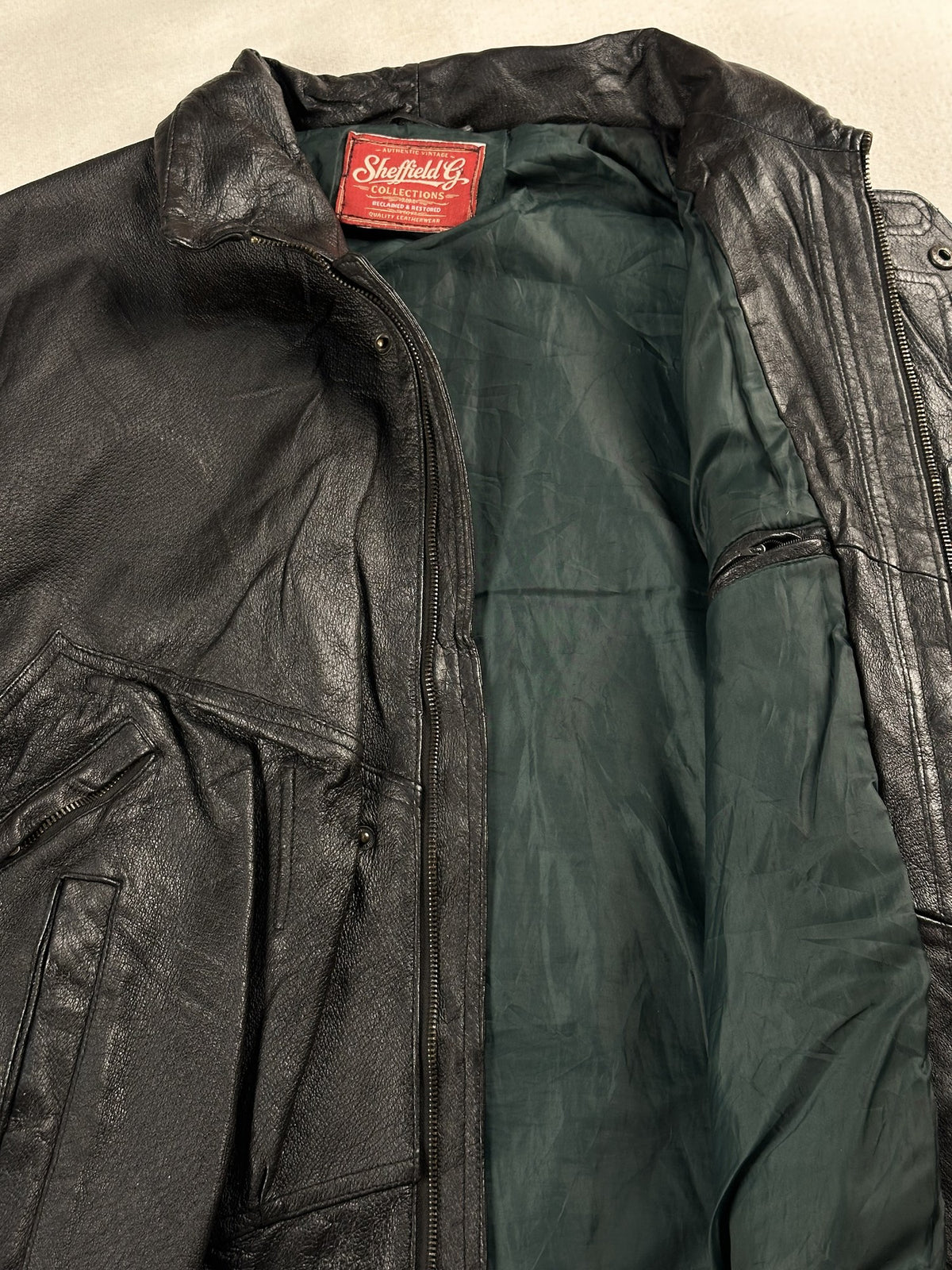 Black leather field jacket, size L - interior lining.