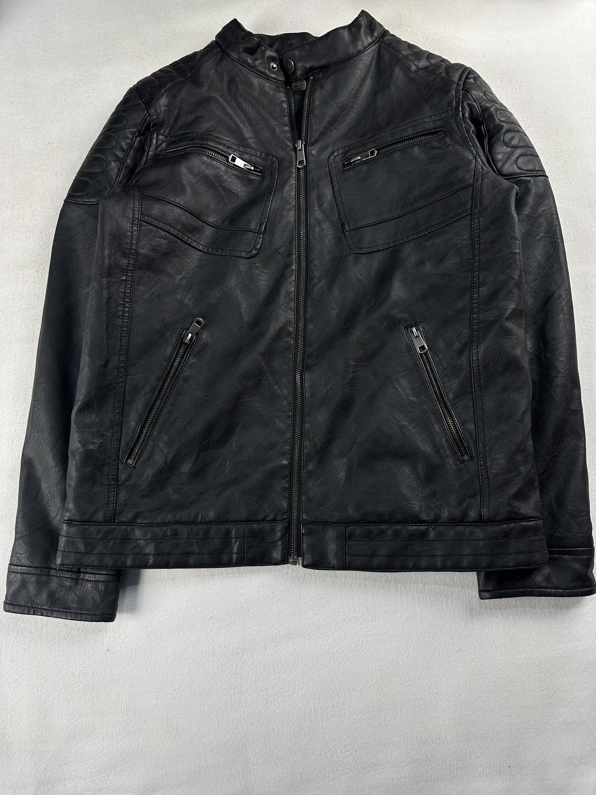 Black leather cafe racer jacket, size M - chest and pocket detail.