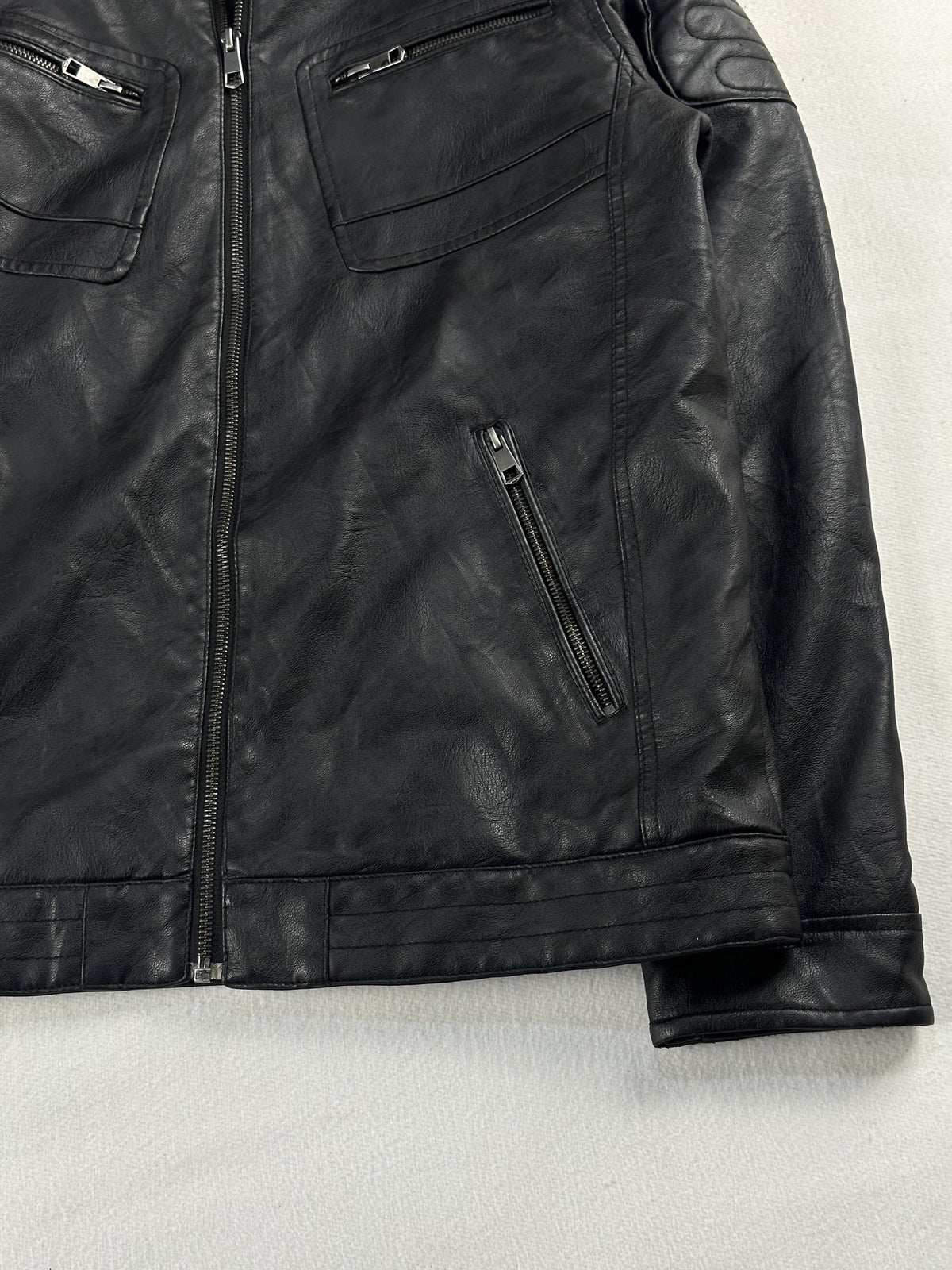 Black leather cafe racer jacket, size M - size and label context.