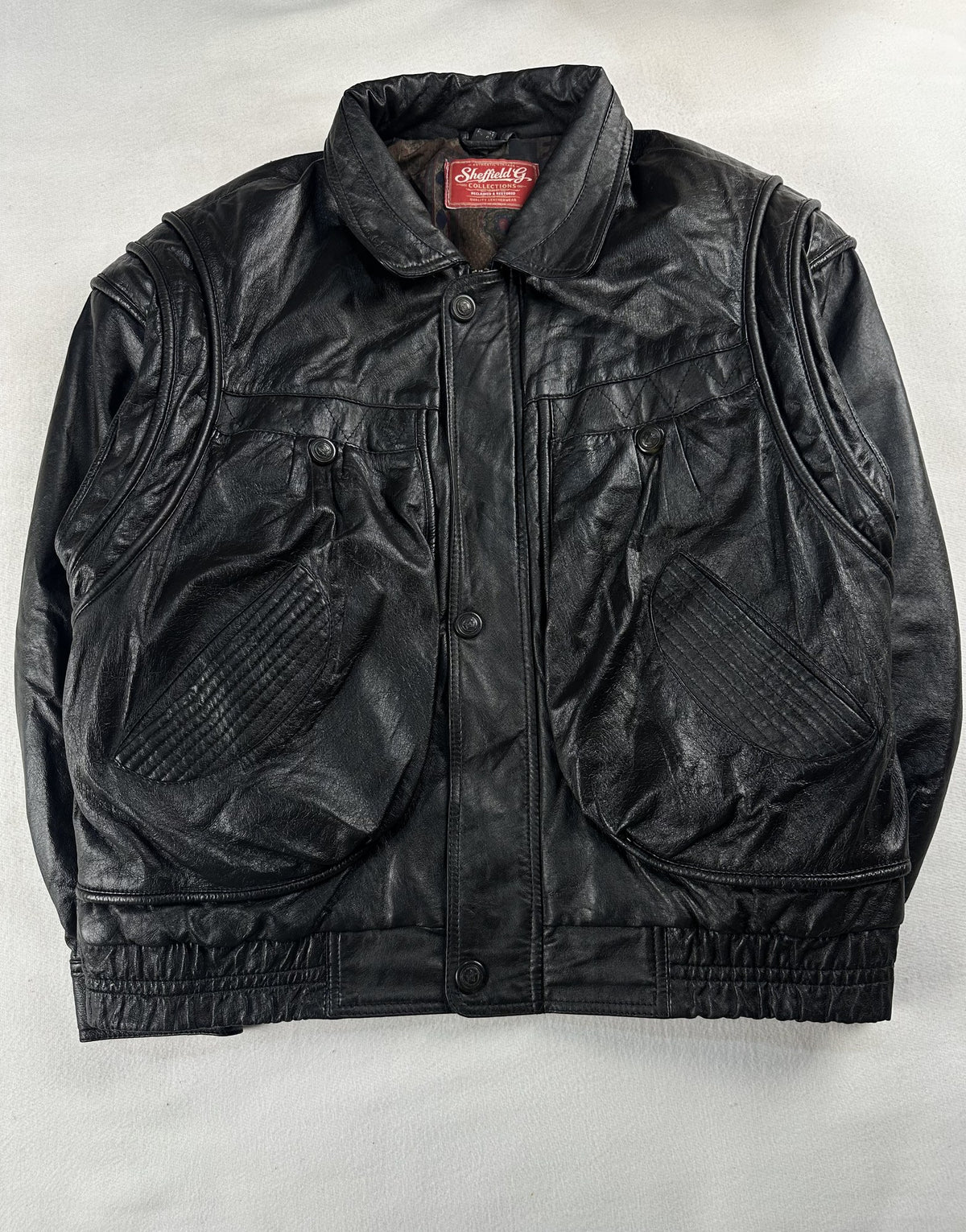 Black leather field jacket, size M - chest and pocket detail.