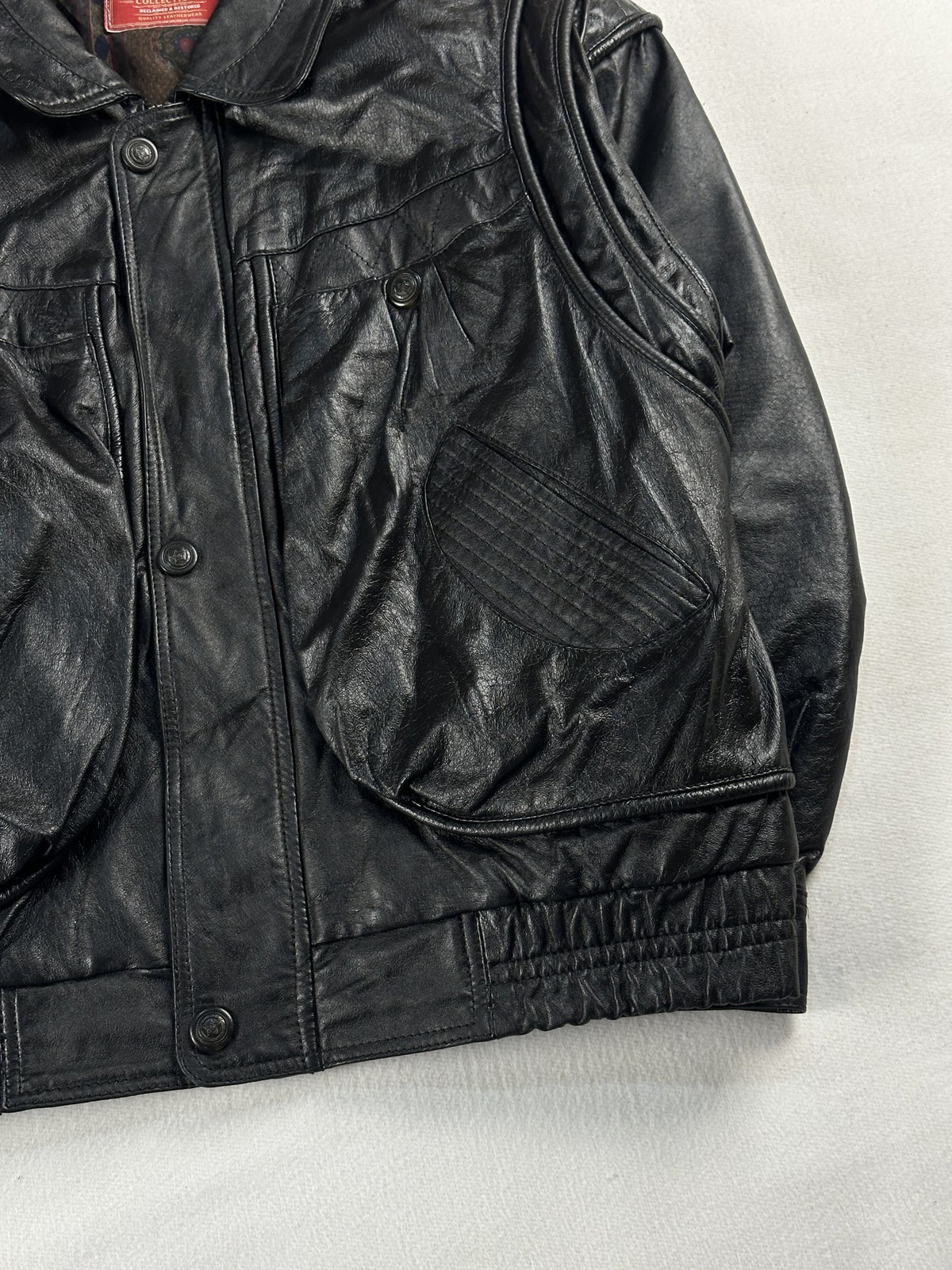 Black leather field jacket, size M - size and label context.