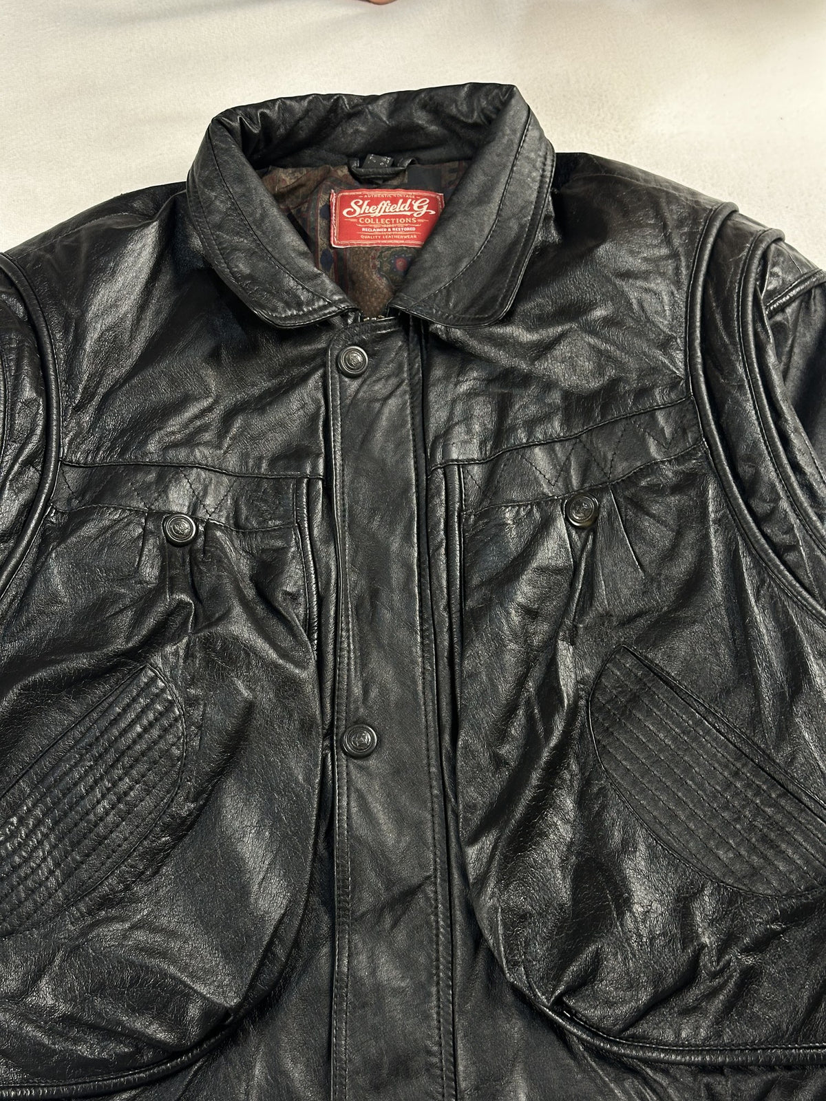 Black leather field jacket, size M - back view.