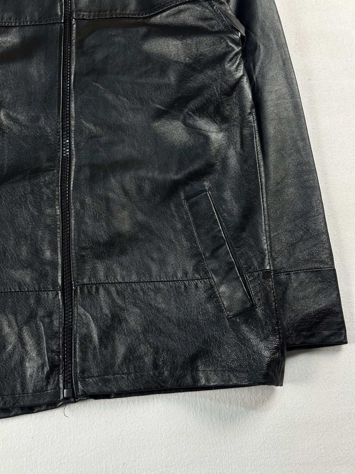 Black leather vintage jacket, size L - size and label context.