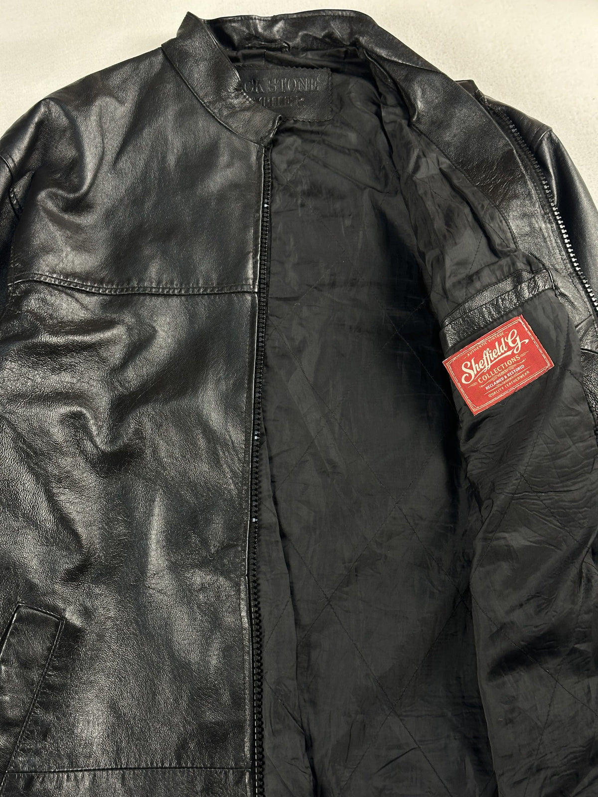 Black leather vintage jacket, size L - cuff and hem detail.