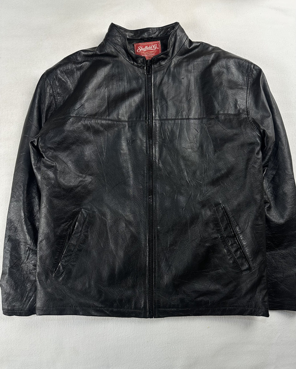 Black leather vintage jacket, size L - chest and pocket detail.