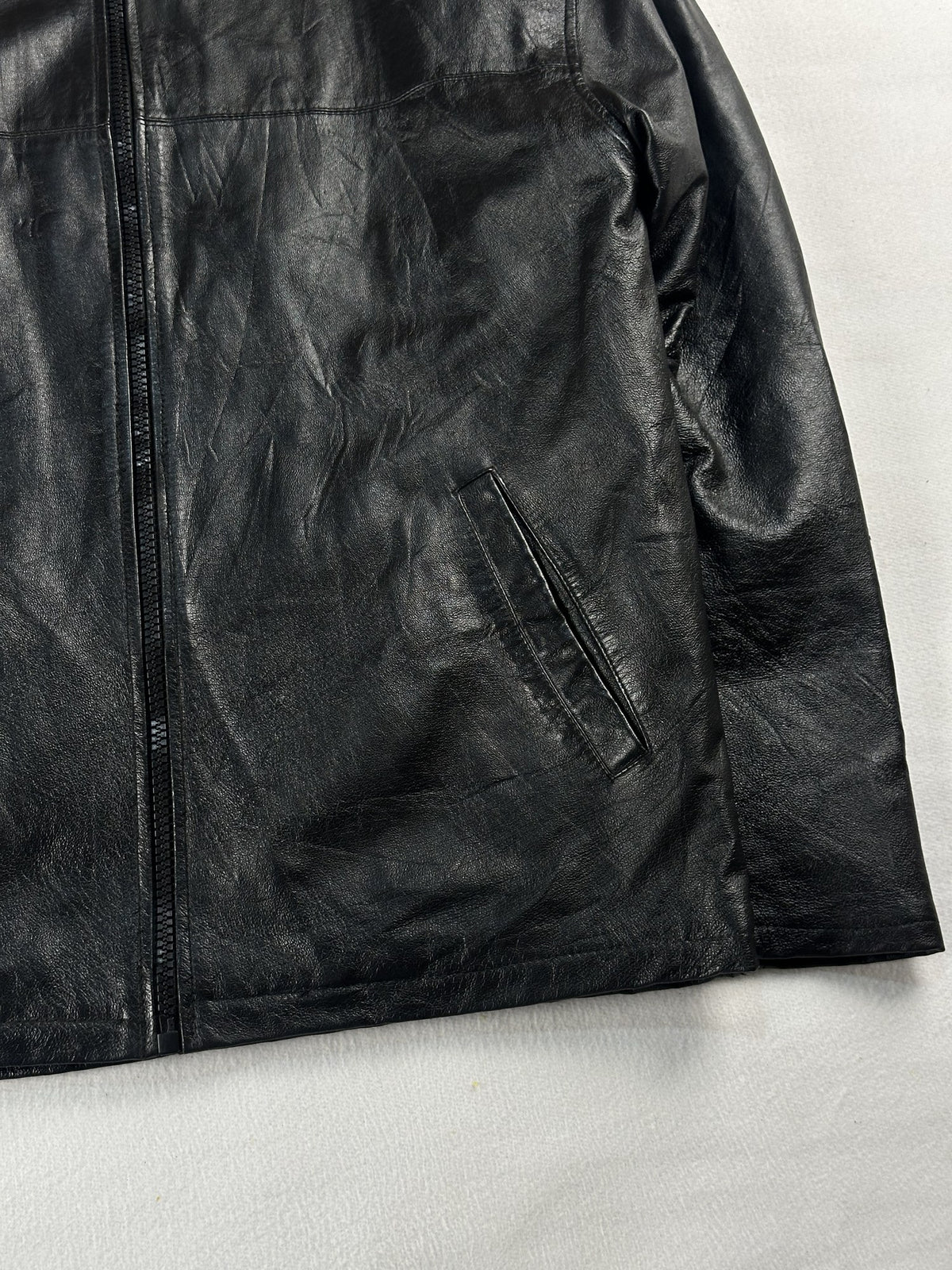 Black leather vintage jacket, size L - size and label context.