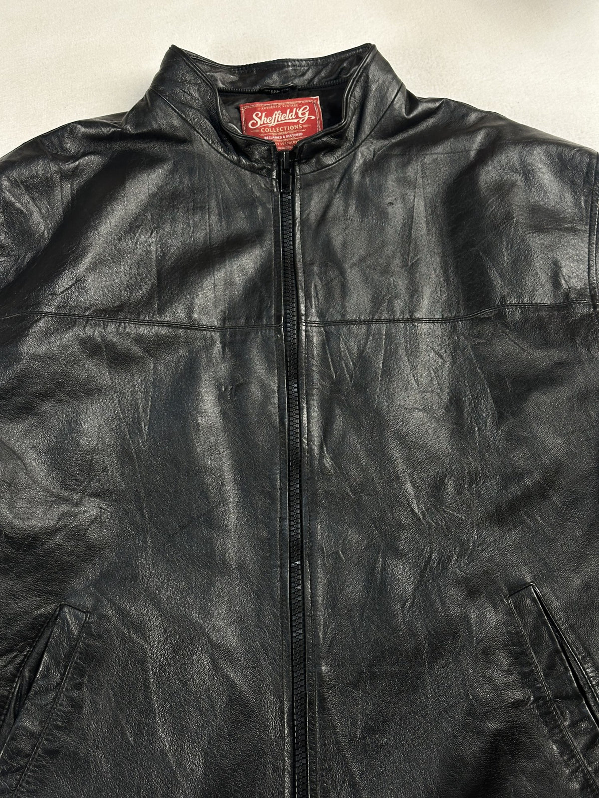 Black leather vintage jacket, size L - back view.