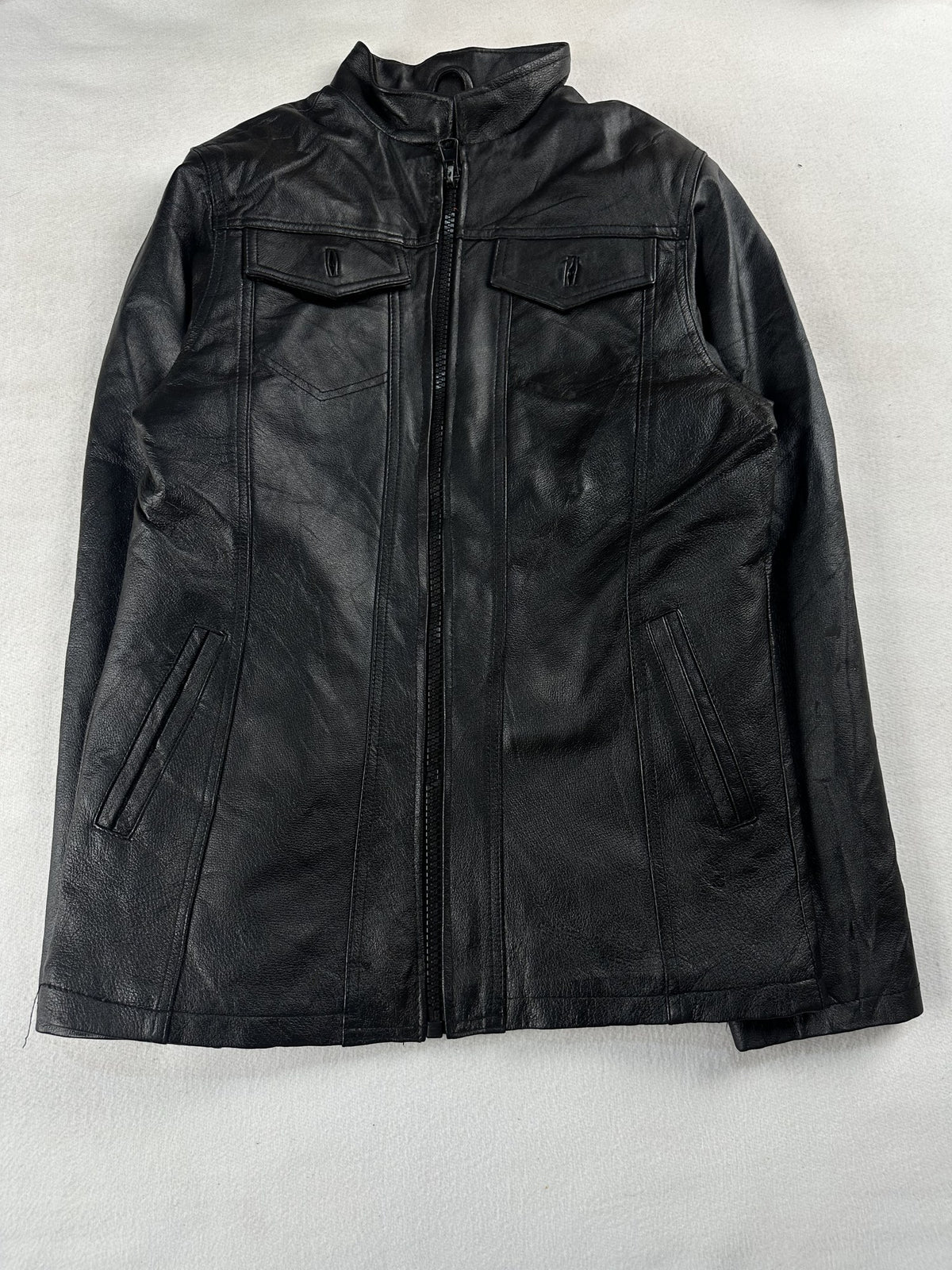 Black leather vintage jacket, size M - chest and pocket detail.