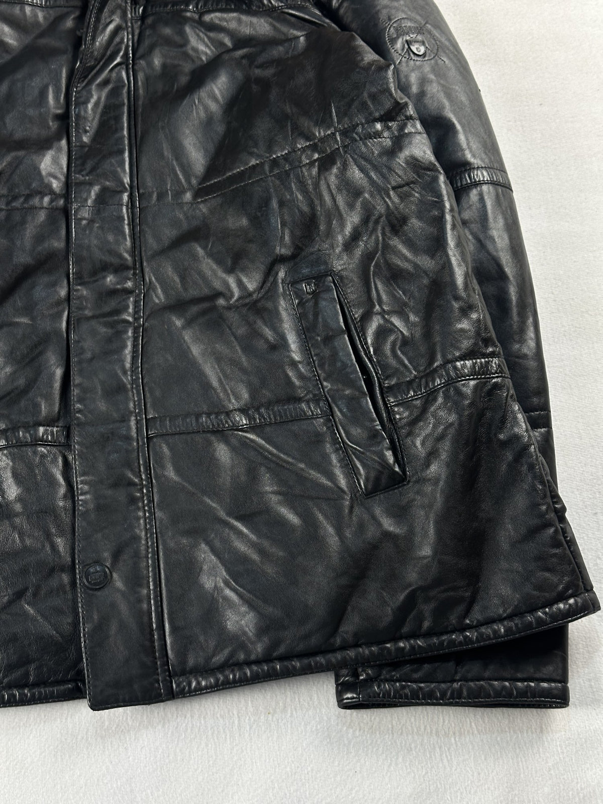 Black leather bomber jacket, size L - size and label context.