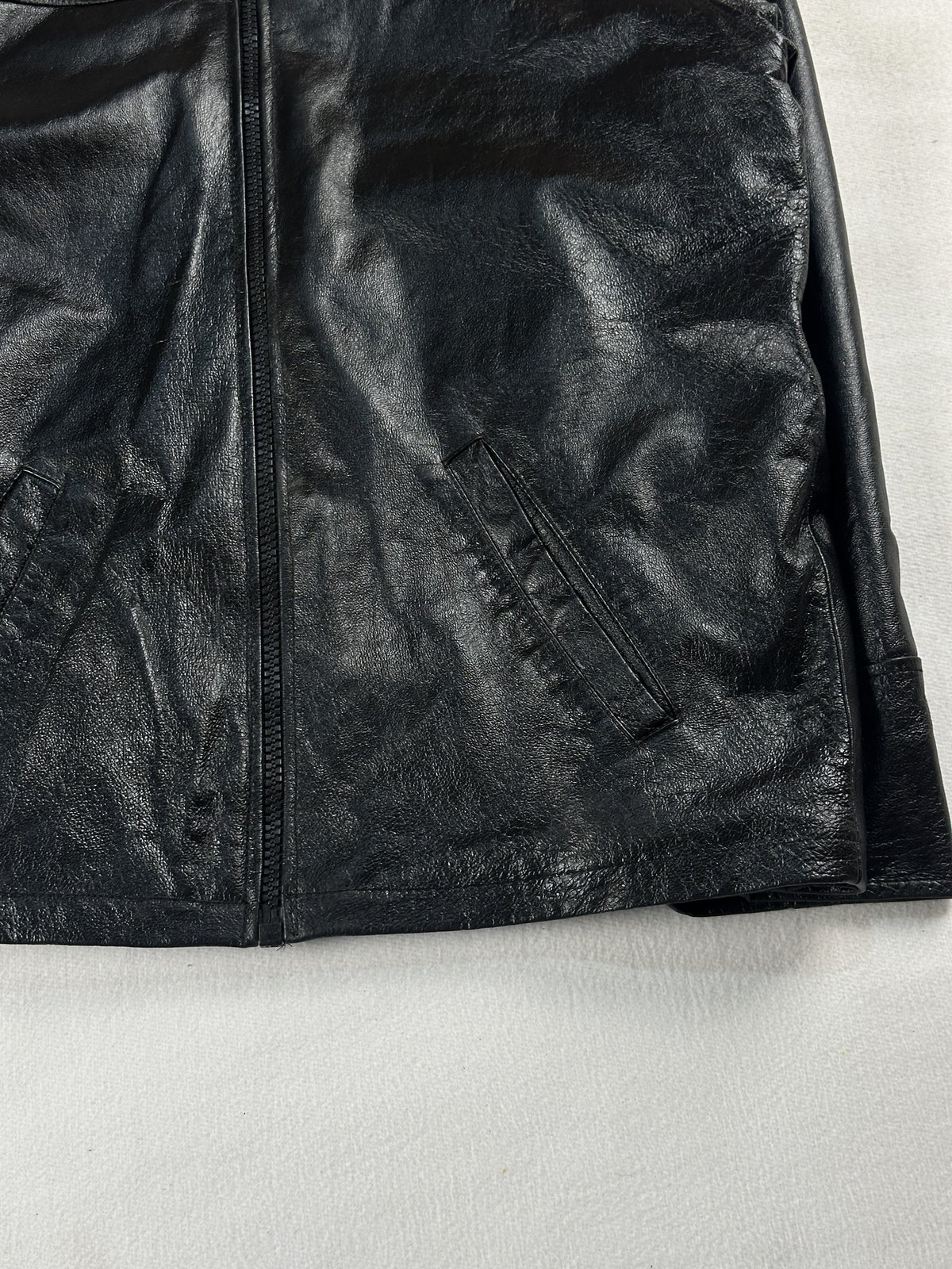 Black leather vintage jacket, size L - size and label context.