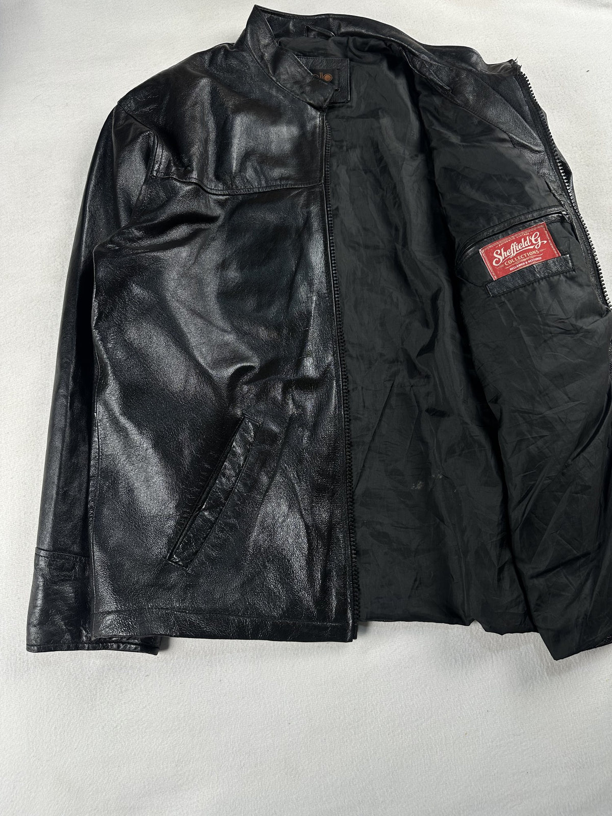 Black leather vintage jacket, size L - cuff and hem detail.