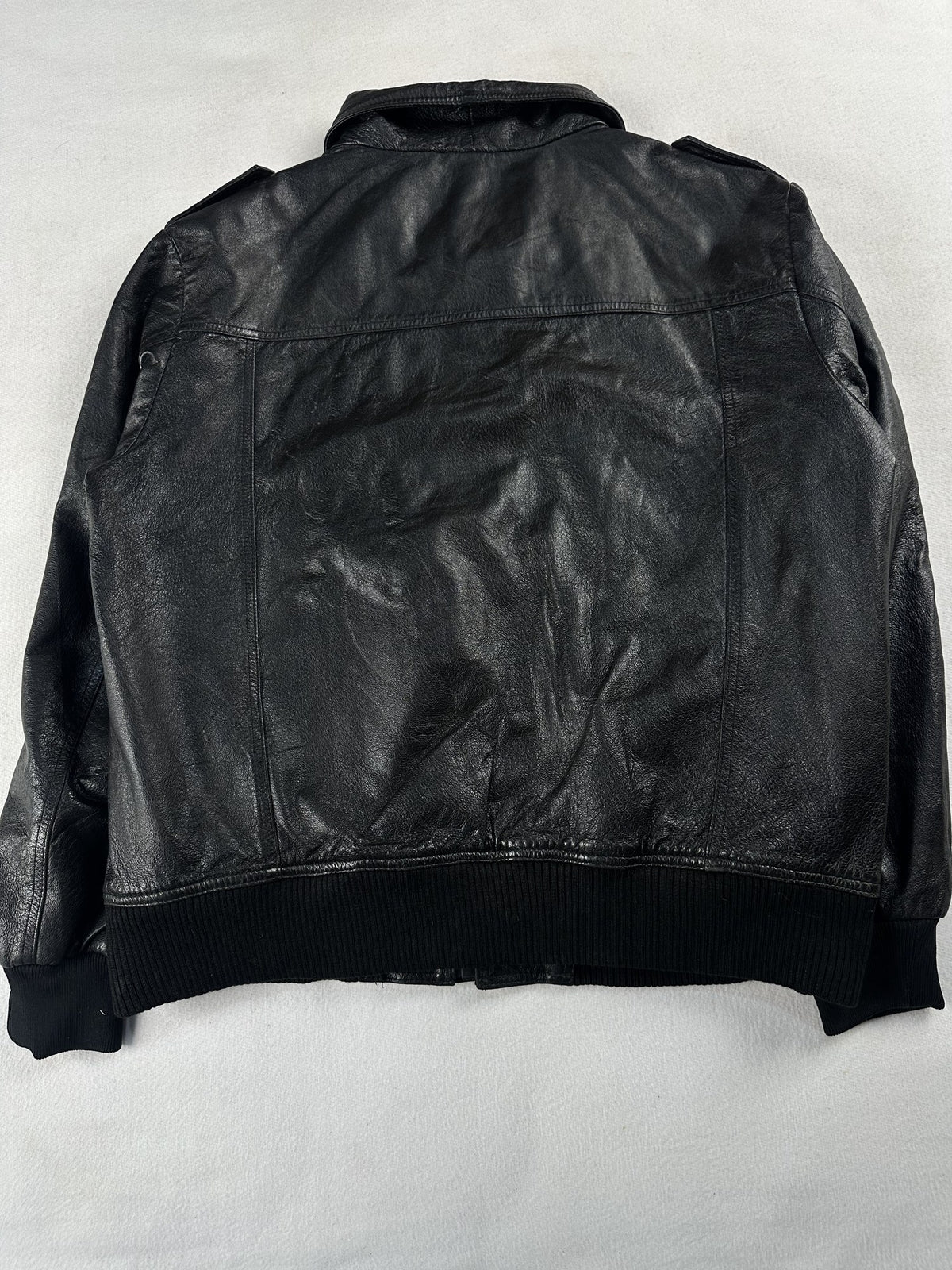 Black leather bomber jacket, size M - collar detail.