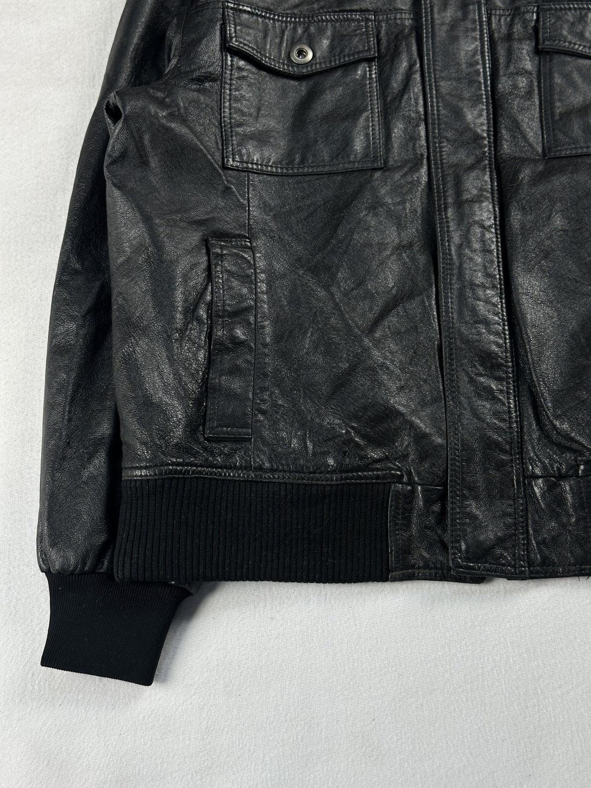 Black leather bomber jacket, size M - sleeve and cuff.