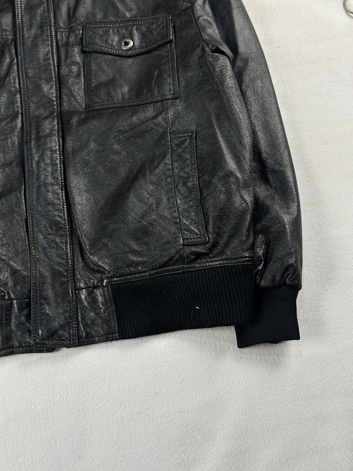 Black leather bomber jacket, size M - size and label context.