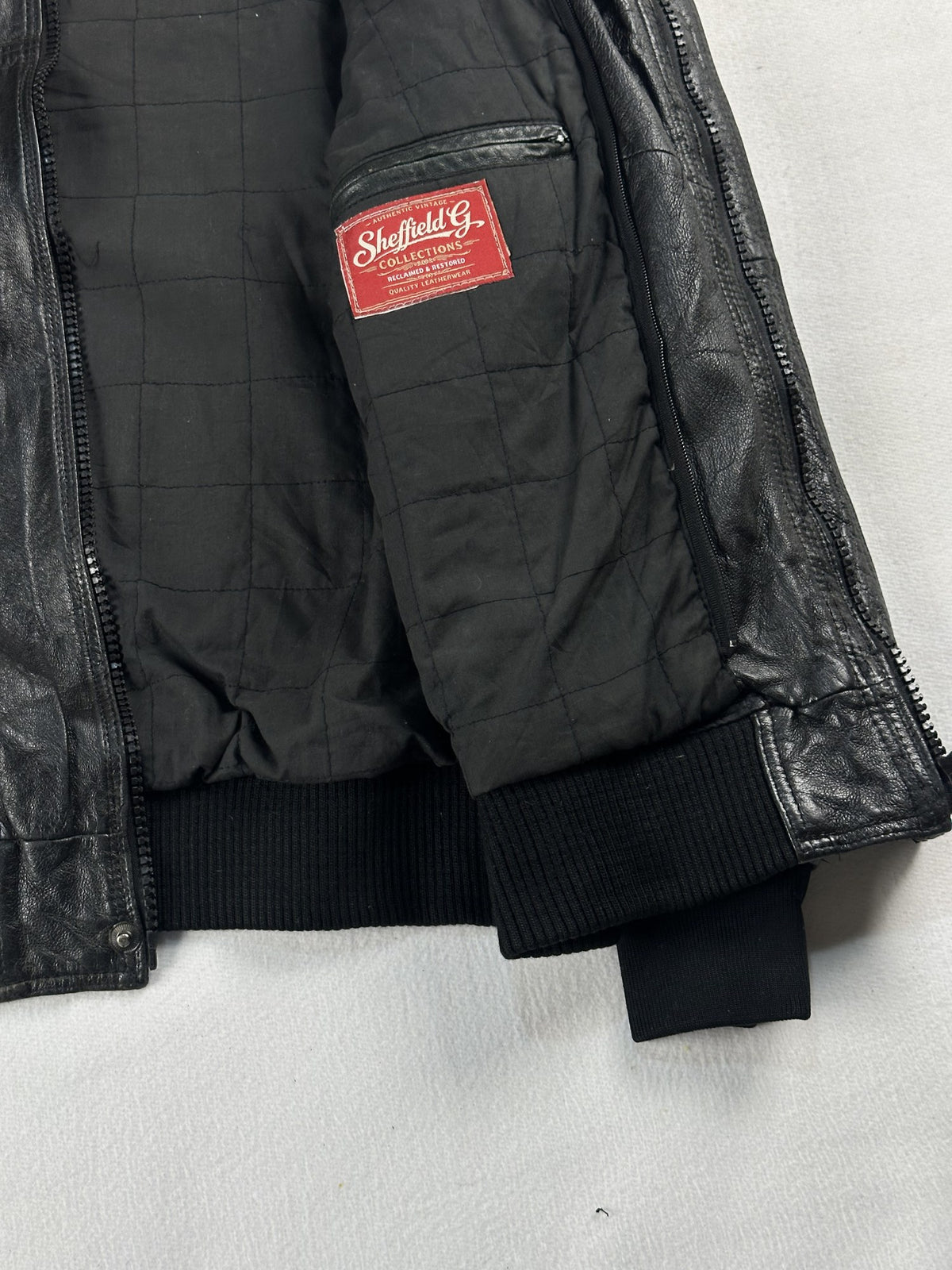 Black leather bomber jacket, size M - interior lining.