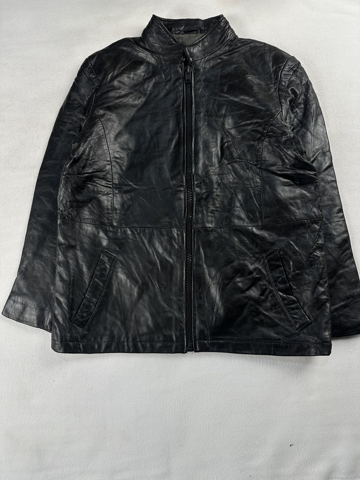 Black leather cafe racer jacket, size M - chest and pocket detail.