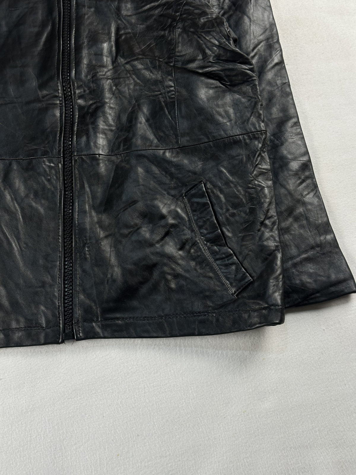 Black leather cafe racer jacket, size M - size and label context.