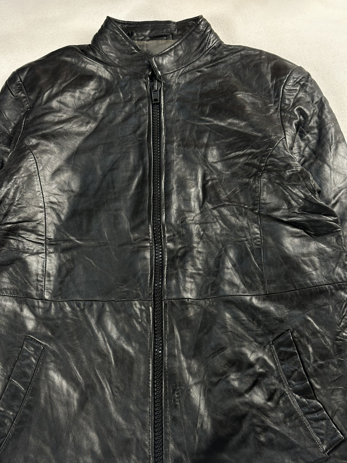 Black leather cafe racer jacket, size M - back view.