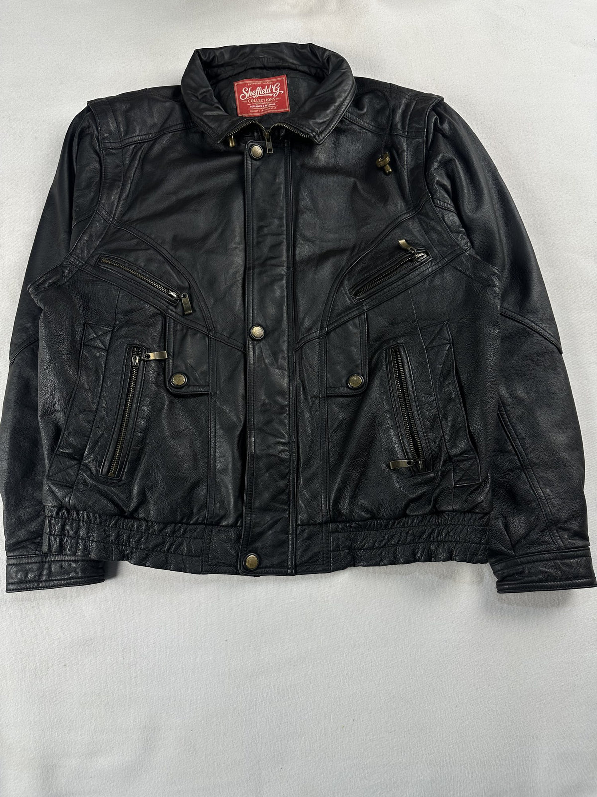 Black leather vintage jacket, size M - chest and pocket detail.