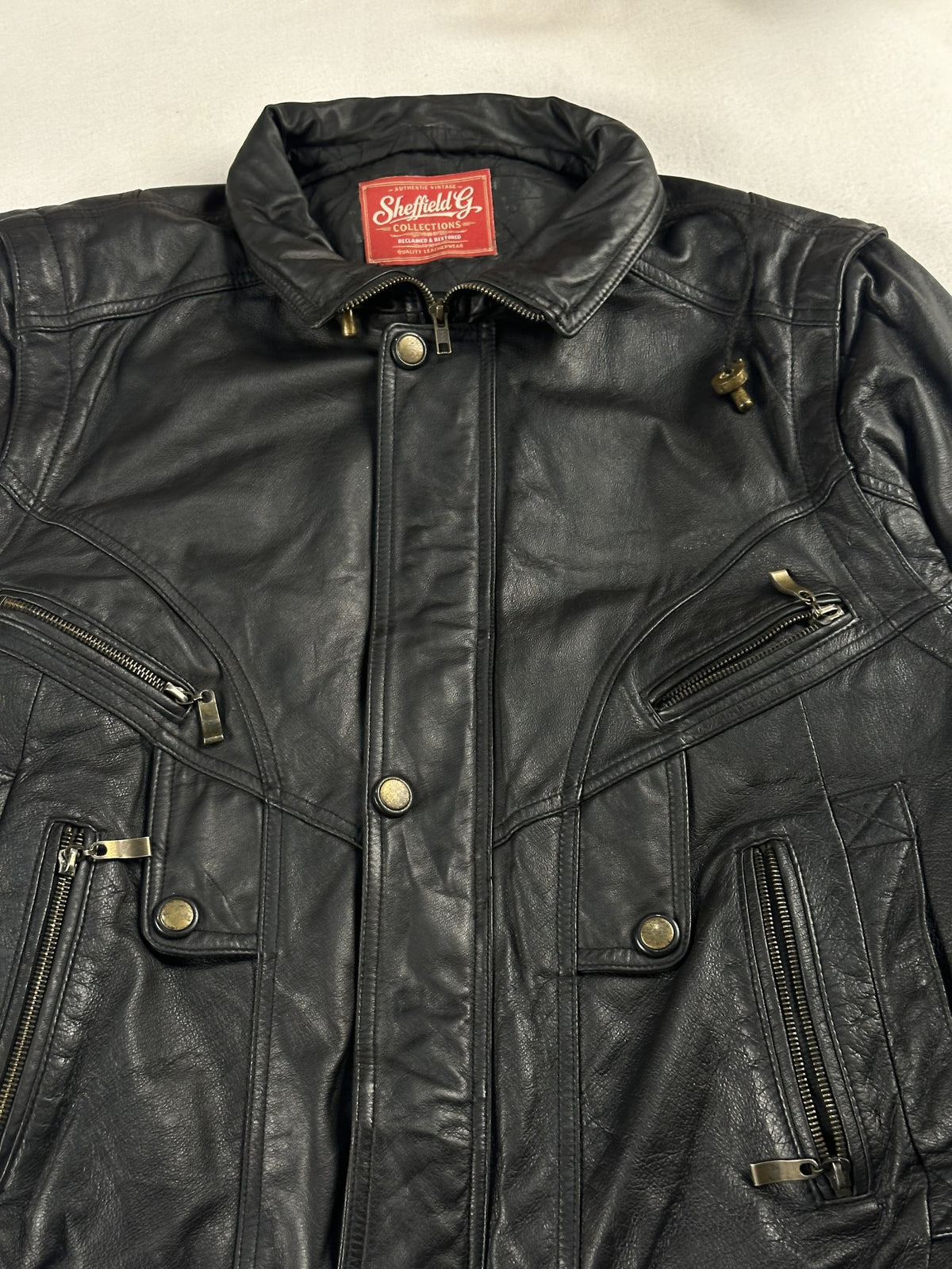 Black leather vintage jacket, size M - back view.