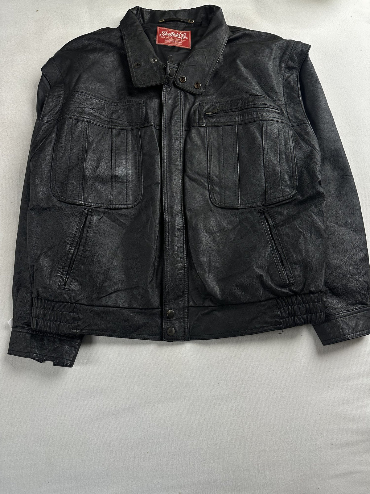 Black leather vintage jacket, size M - chest and pocket detail.