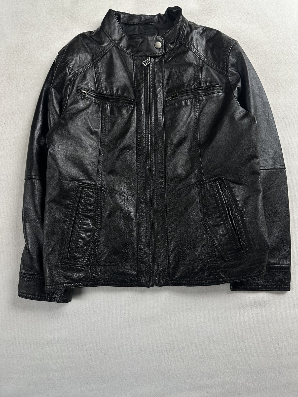 Black leather cafe racer jacket, size XS - chest and pocket detail.