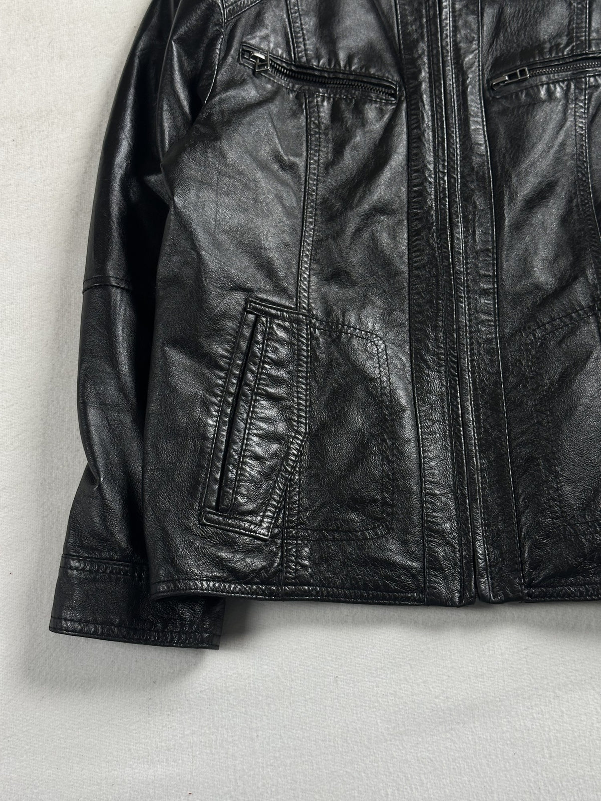 Black leather cafe racer jacket, size XS - sleeve and cuff.