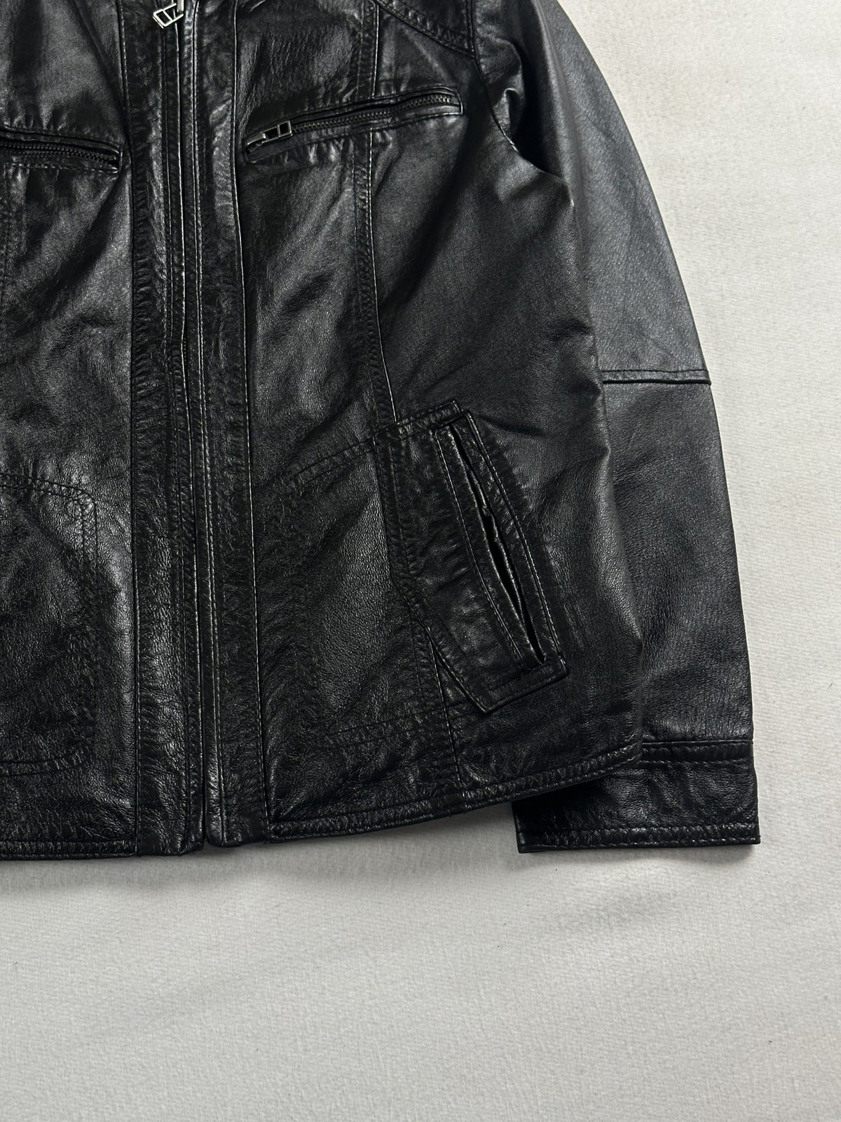 Black leather cafe racer jacket, size XS - size and label context.