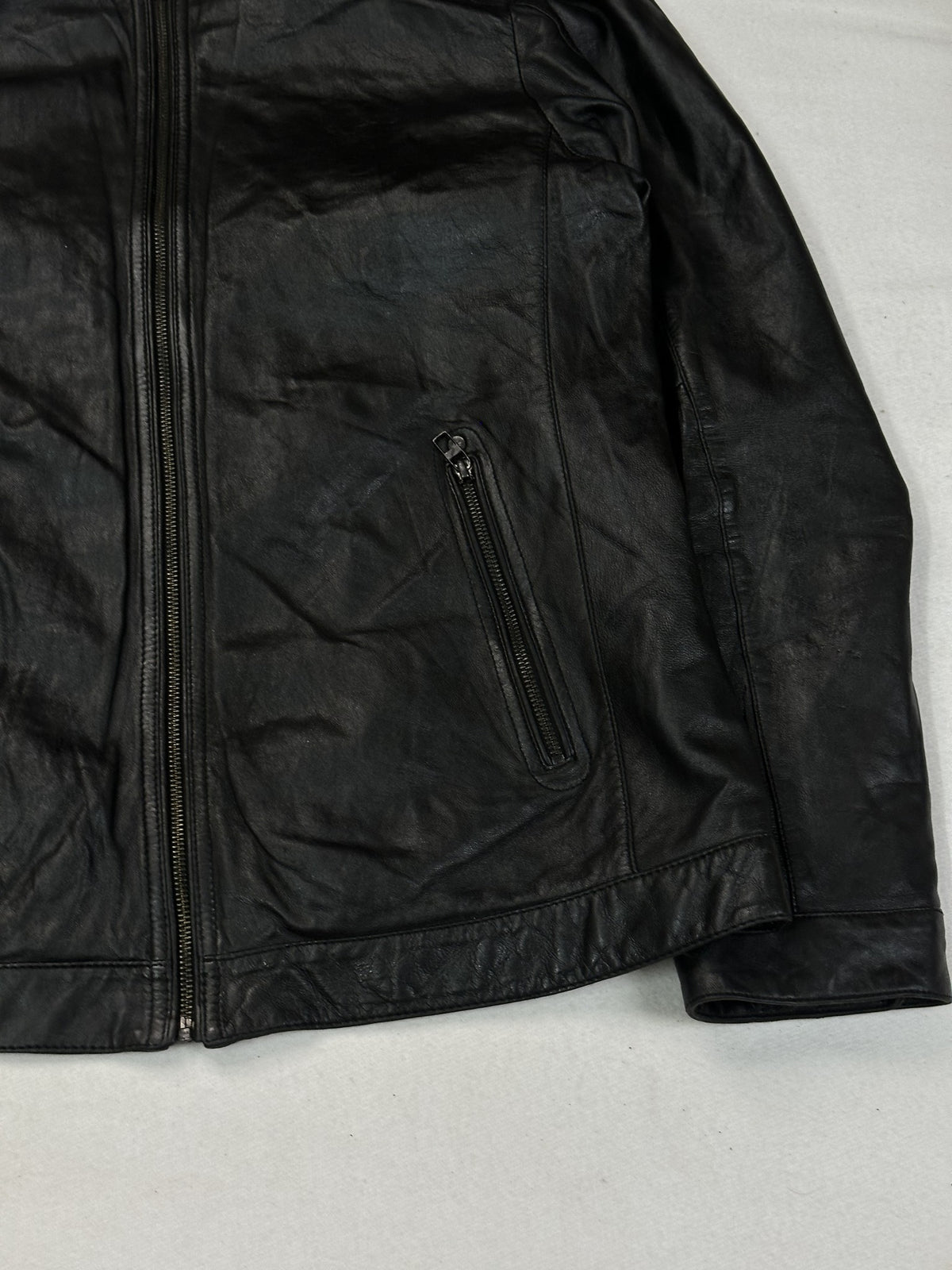 Size L cafe racer in black real leather with a 24 inch chest.