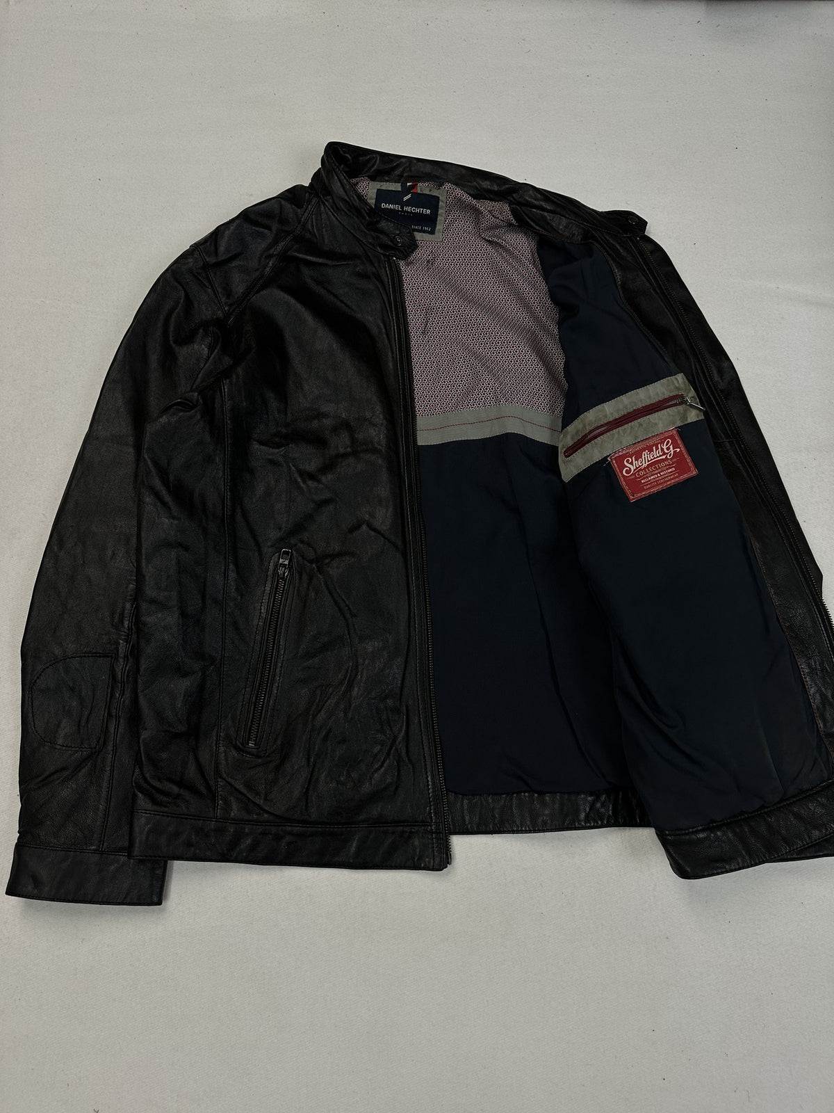 Back panel of the black leather cafe racer jacket.