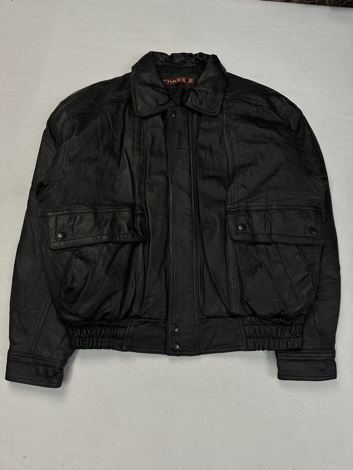 Chest pocket on the black leather harrington jacket.