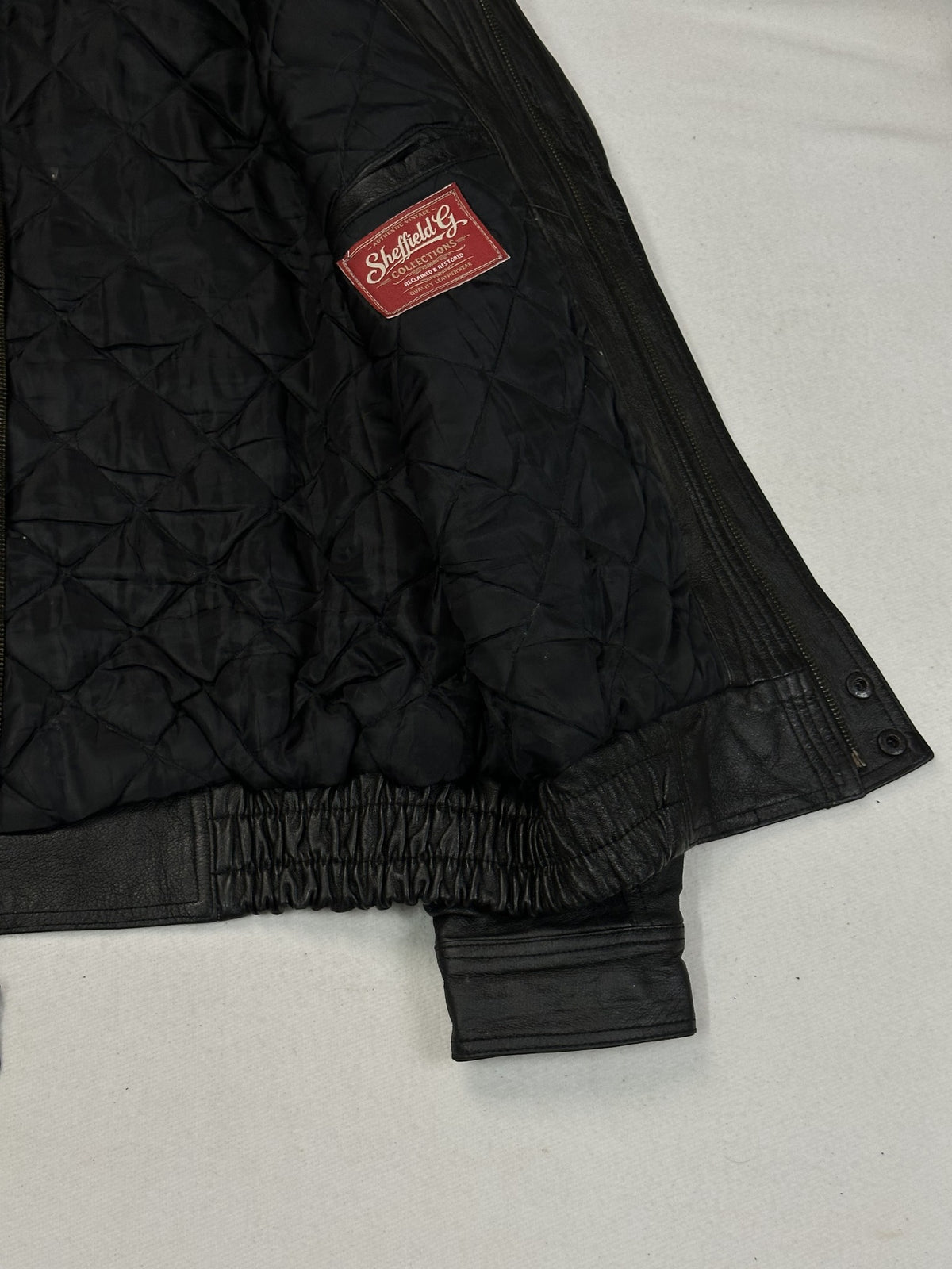 Interior of the size M black leather harrington.