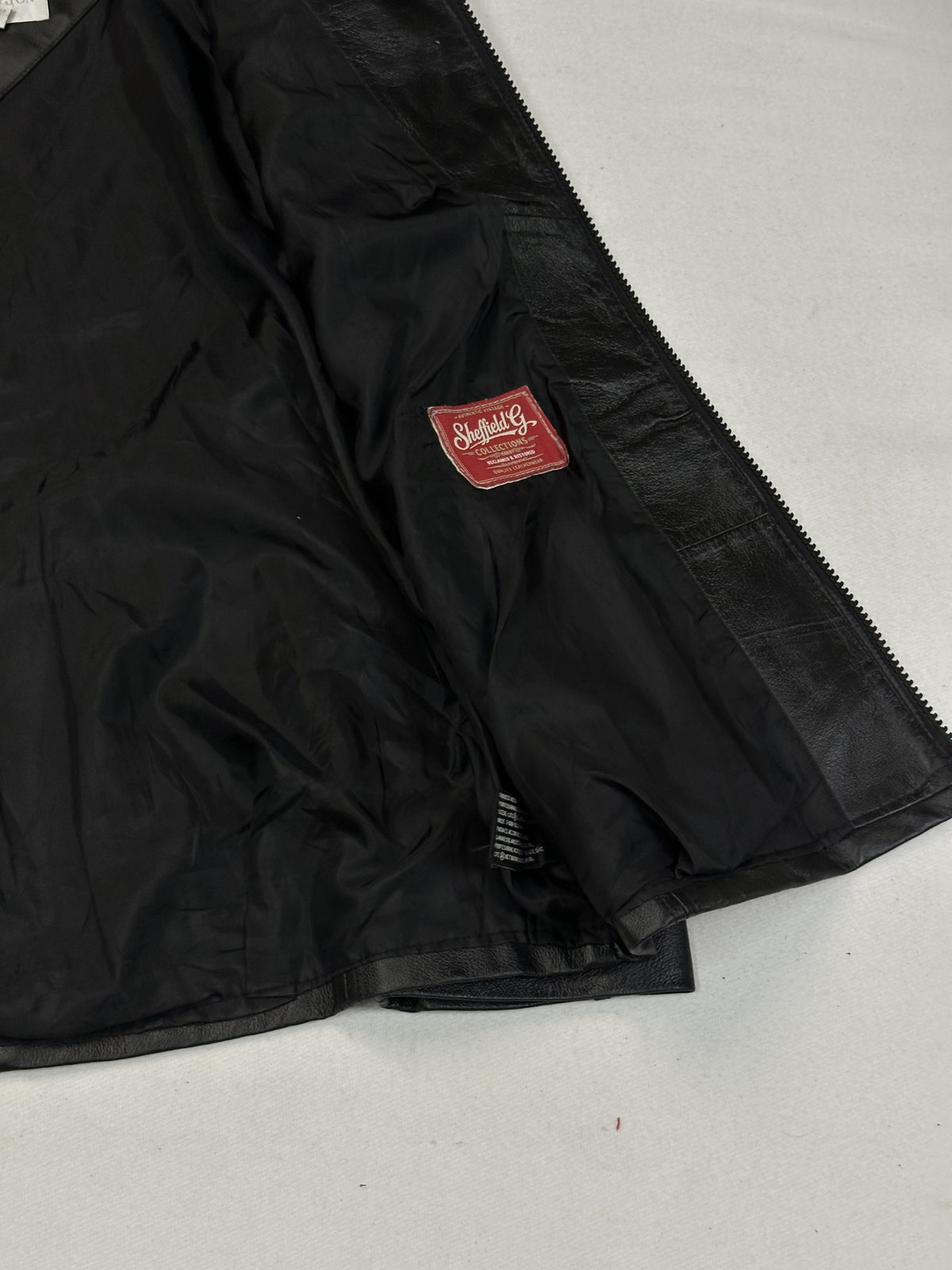 Black leather cafe racer jacket, size L - interior lining.