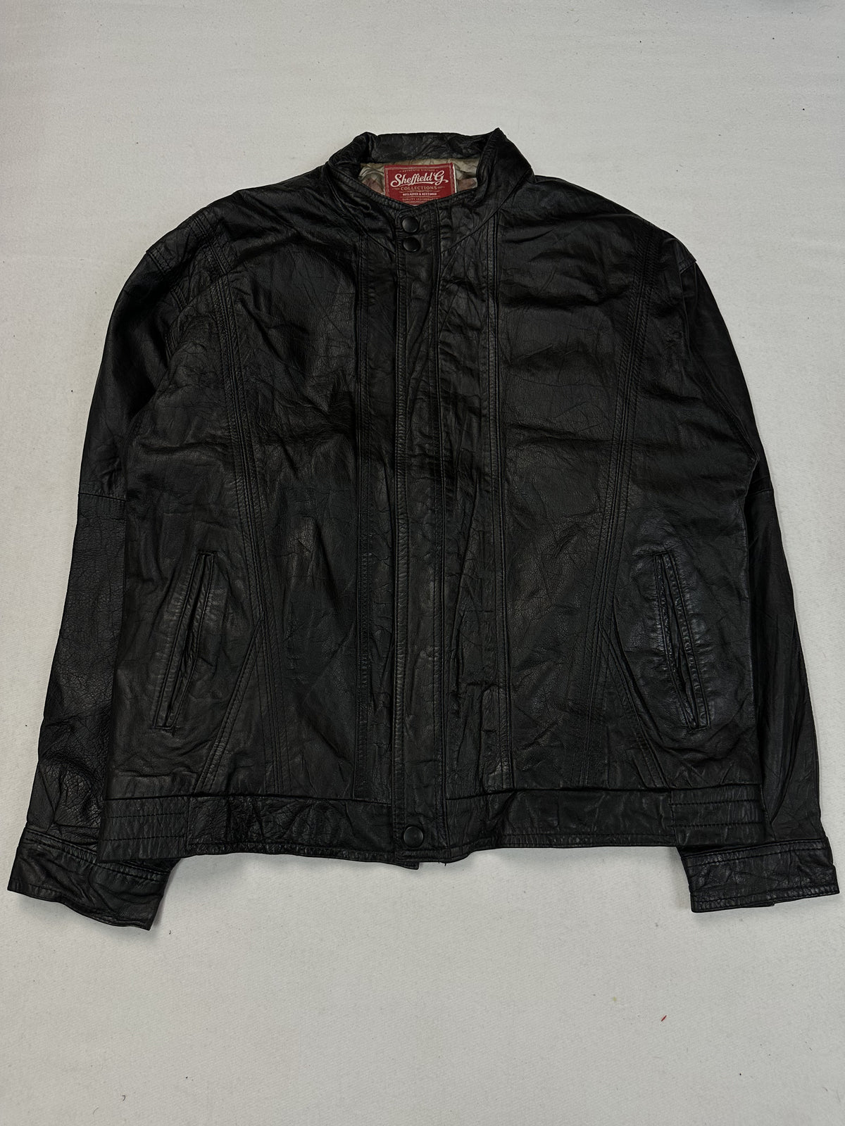 Black leather vintage jacket, size L - chest and pocket detail.