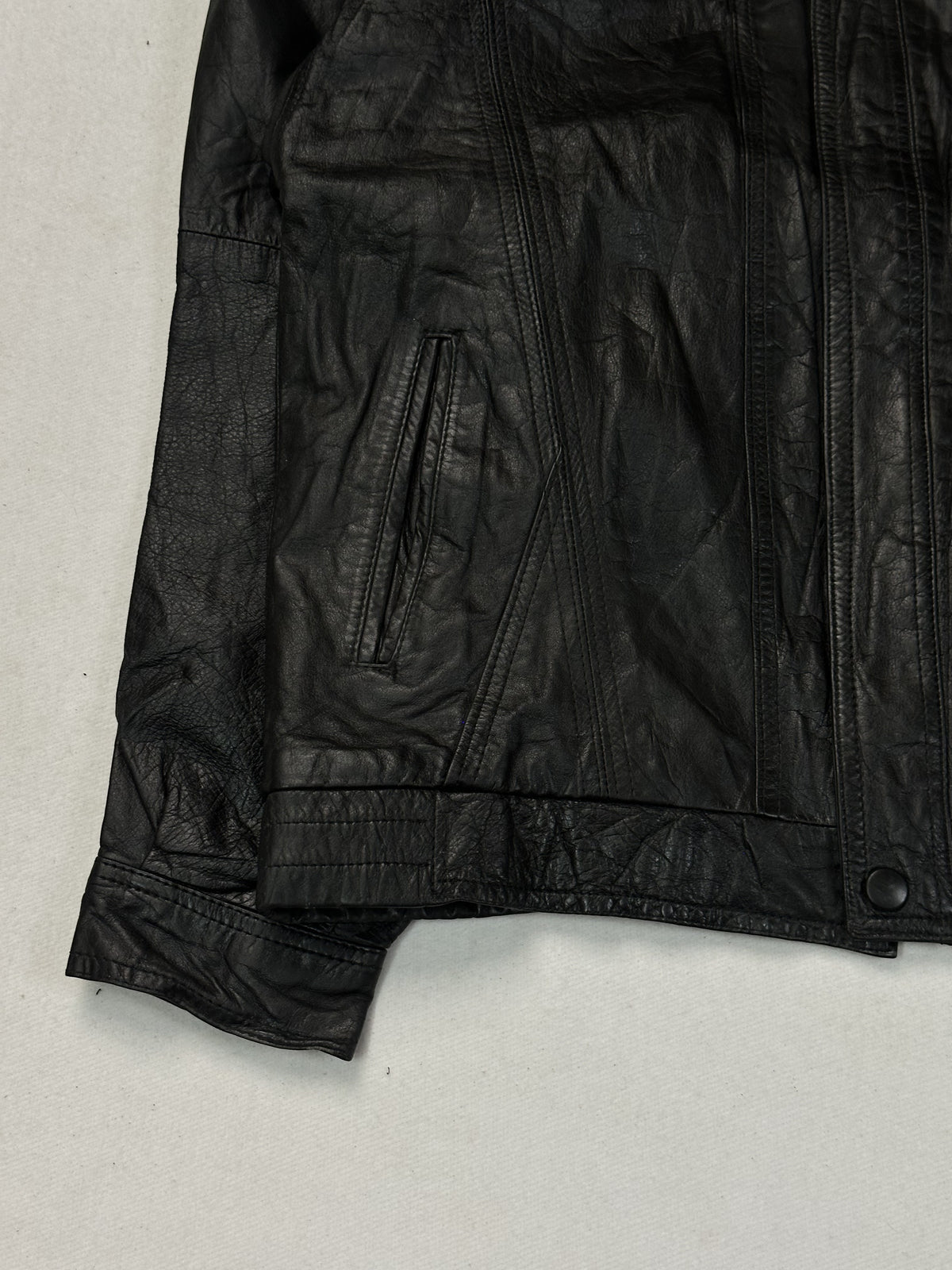 Black leather vintage jacket, size L - size and label context.