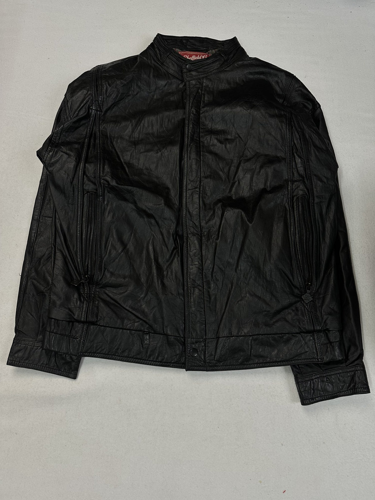 Black leather cafe racer jacket, size L - chest and pocket detail.