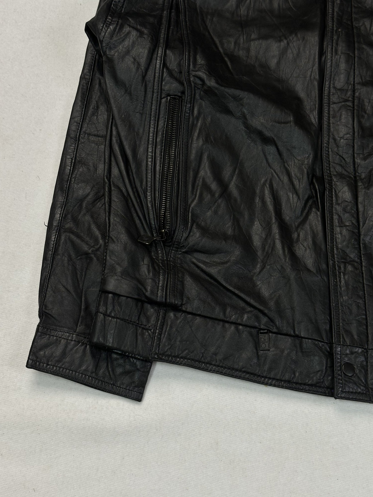 Black leather cafe racer jacket, size L - sleeve and cuff.