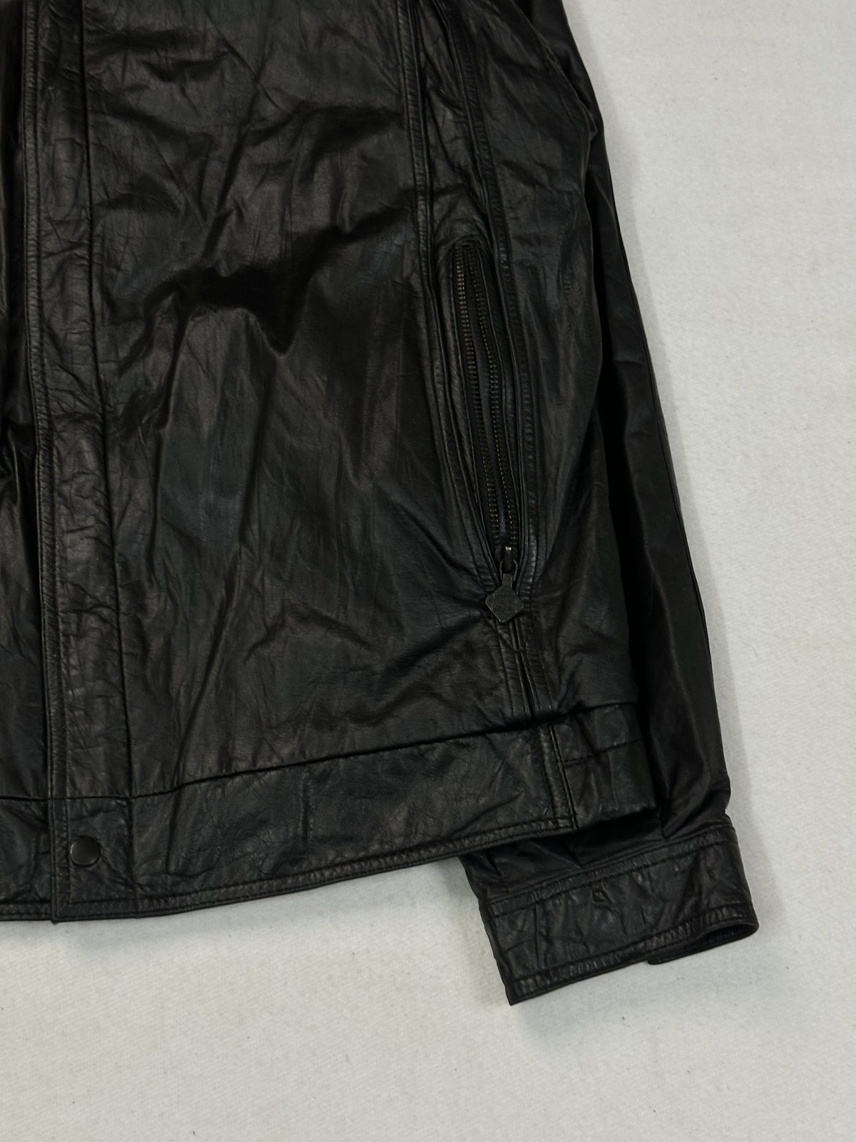 Black leather cafe racer jacket, size L - size and label context.