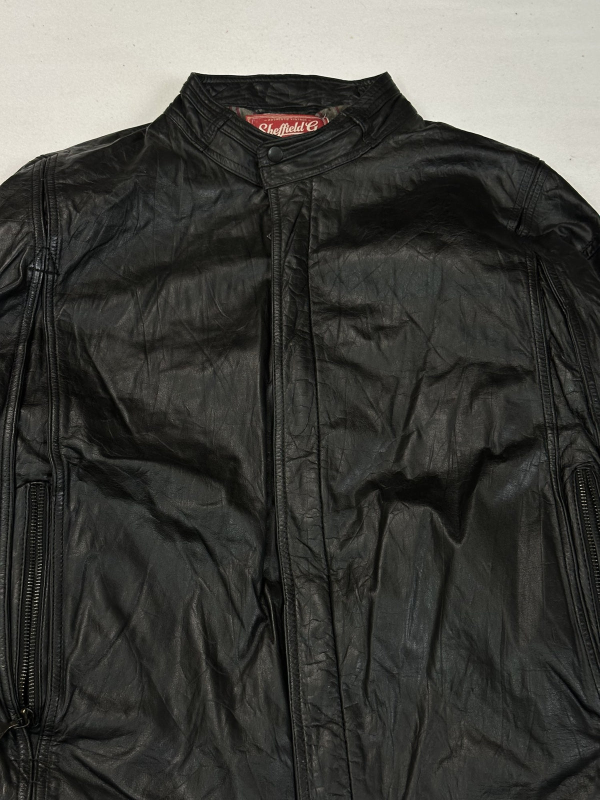 Black leather cafe racer jacket, size L - back view.