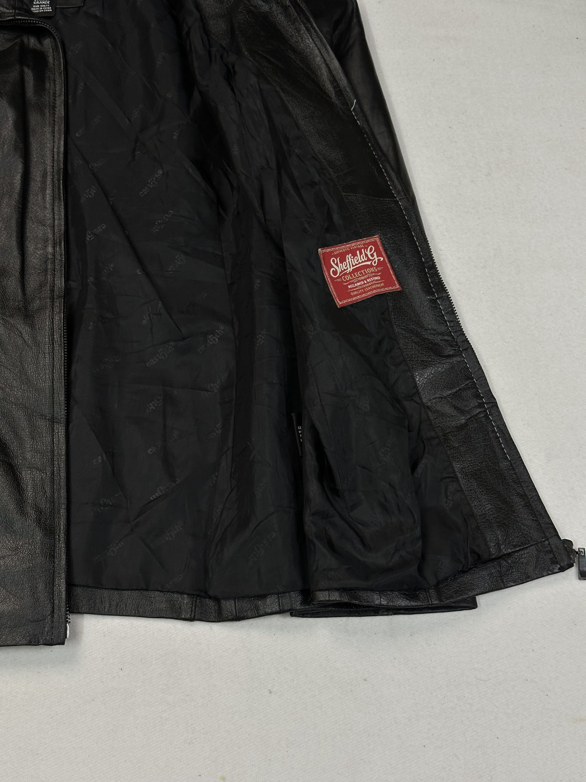 Black leather vintage jacket, size L - size and label context.