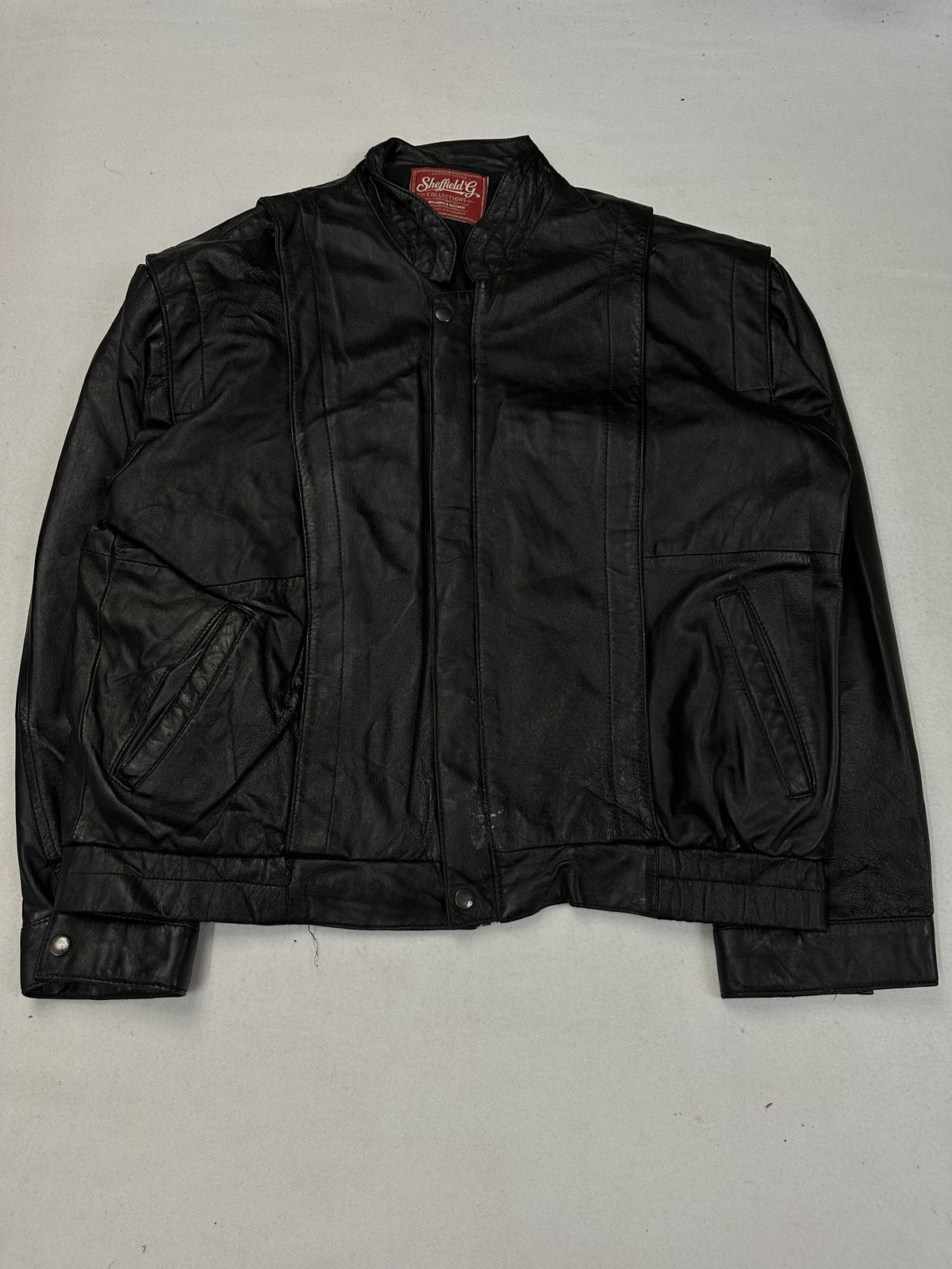 Black leather vintage jacket, size M - chest and pocket detail.