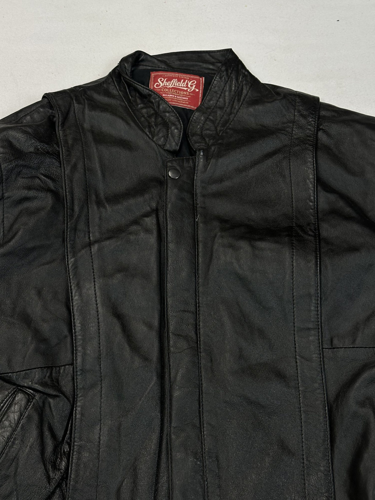 Black leather vintage jacket, size M - back view.
