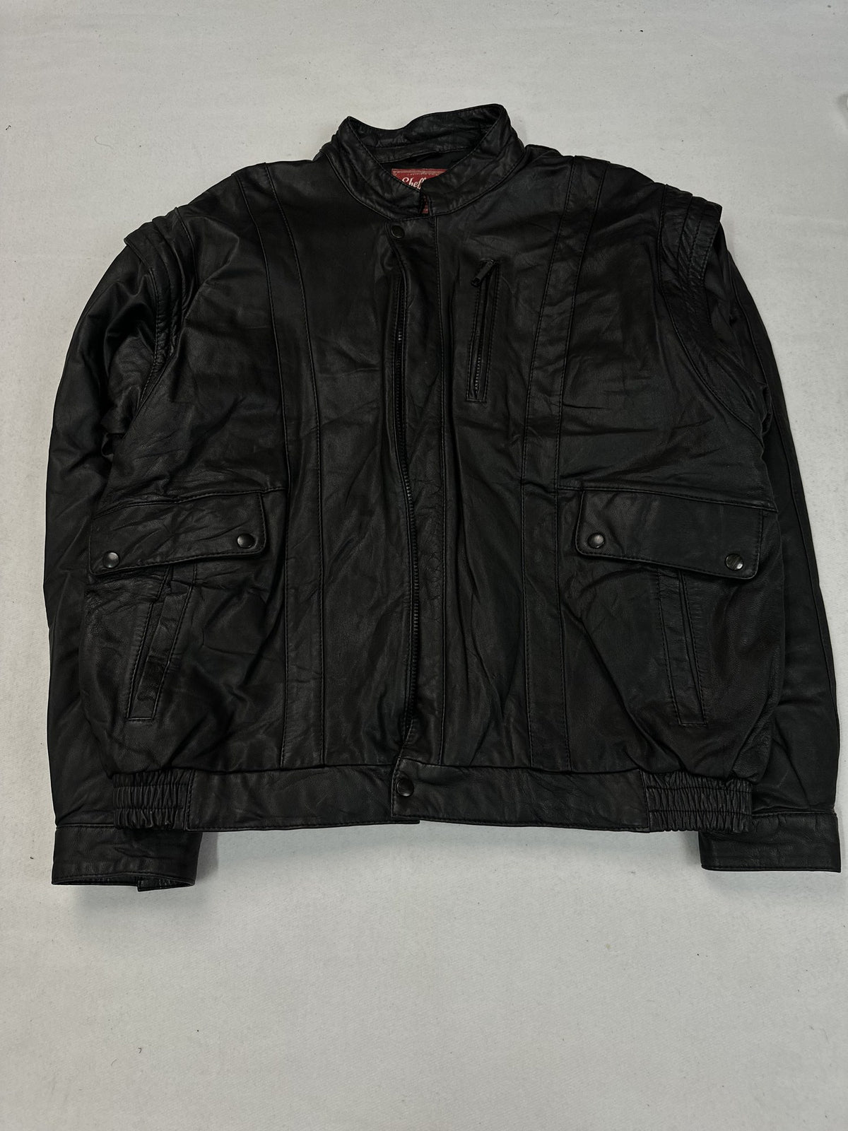 Black leather vintage jacket, size L - chest and pocket detail.