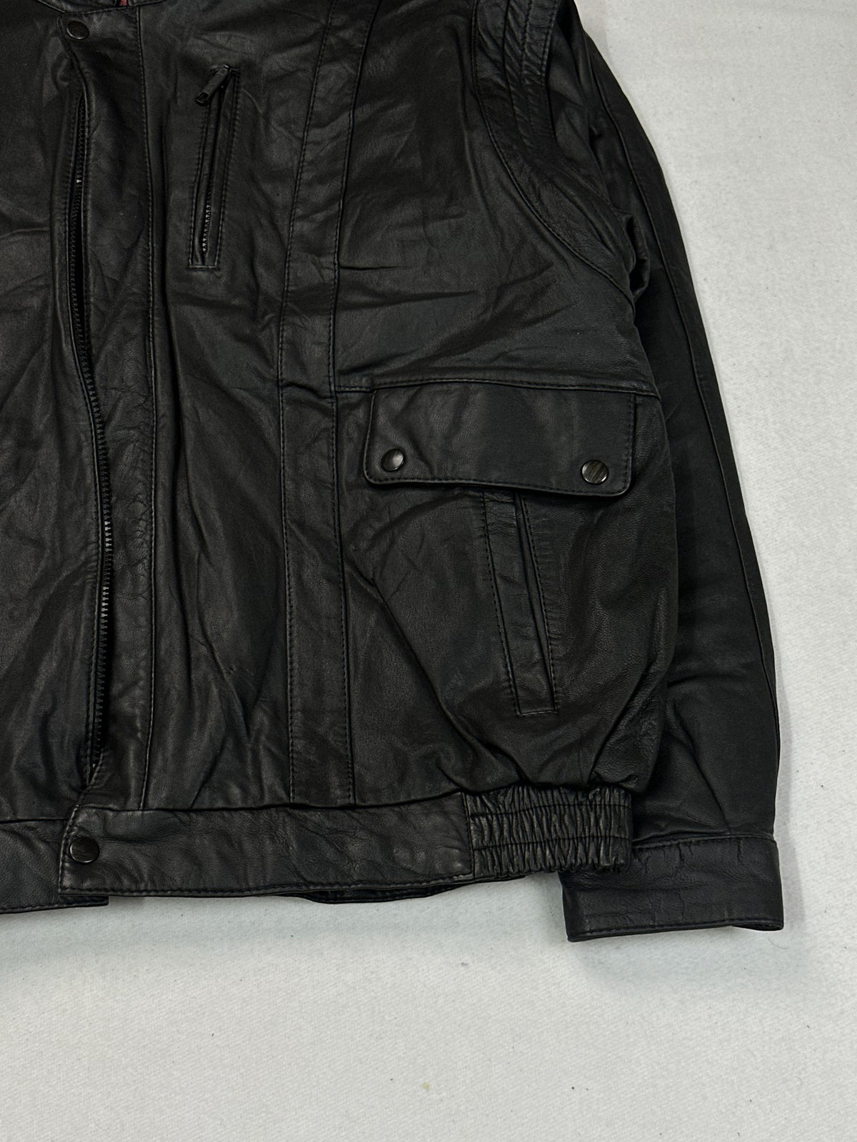 Black leather vintage jacket, size L - size and label context.