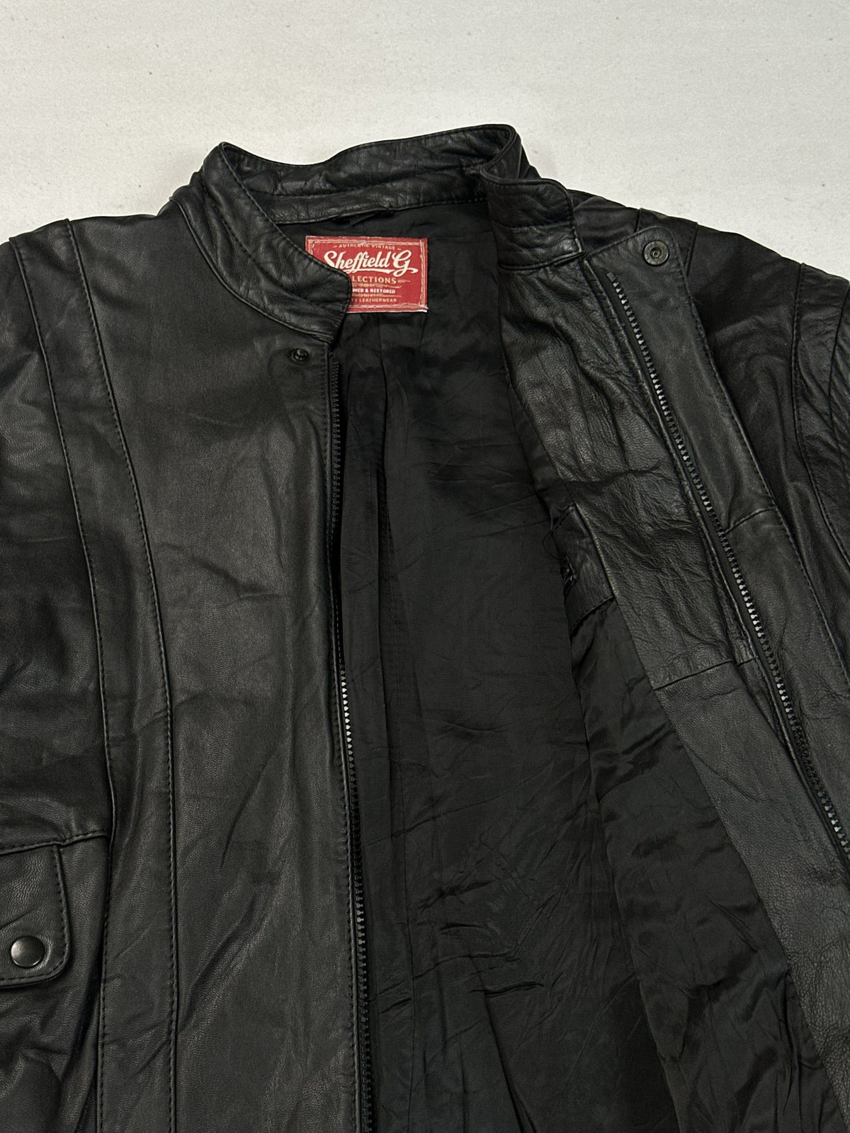 Black leather vintage jacket, size L - back view.