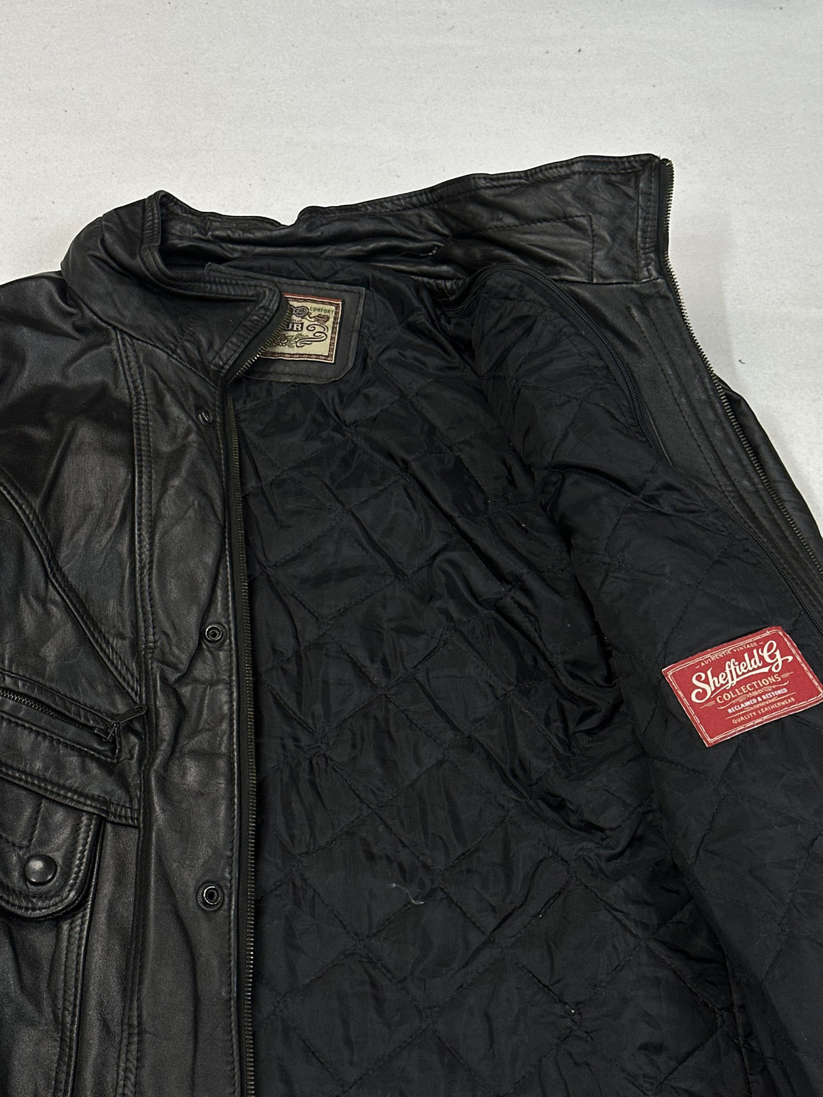 Black leather field jacket, size L - size and label context.