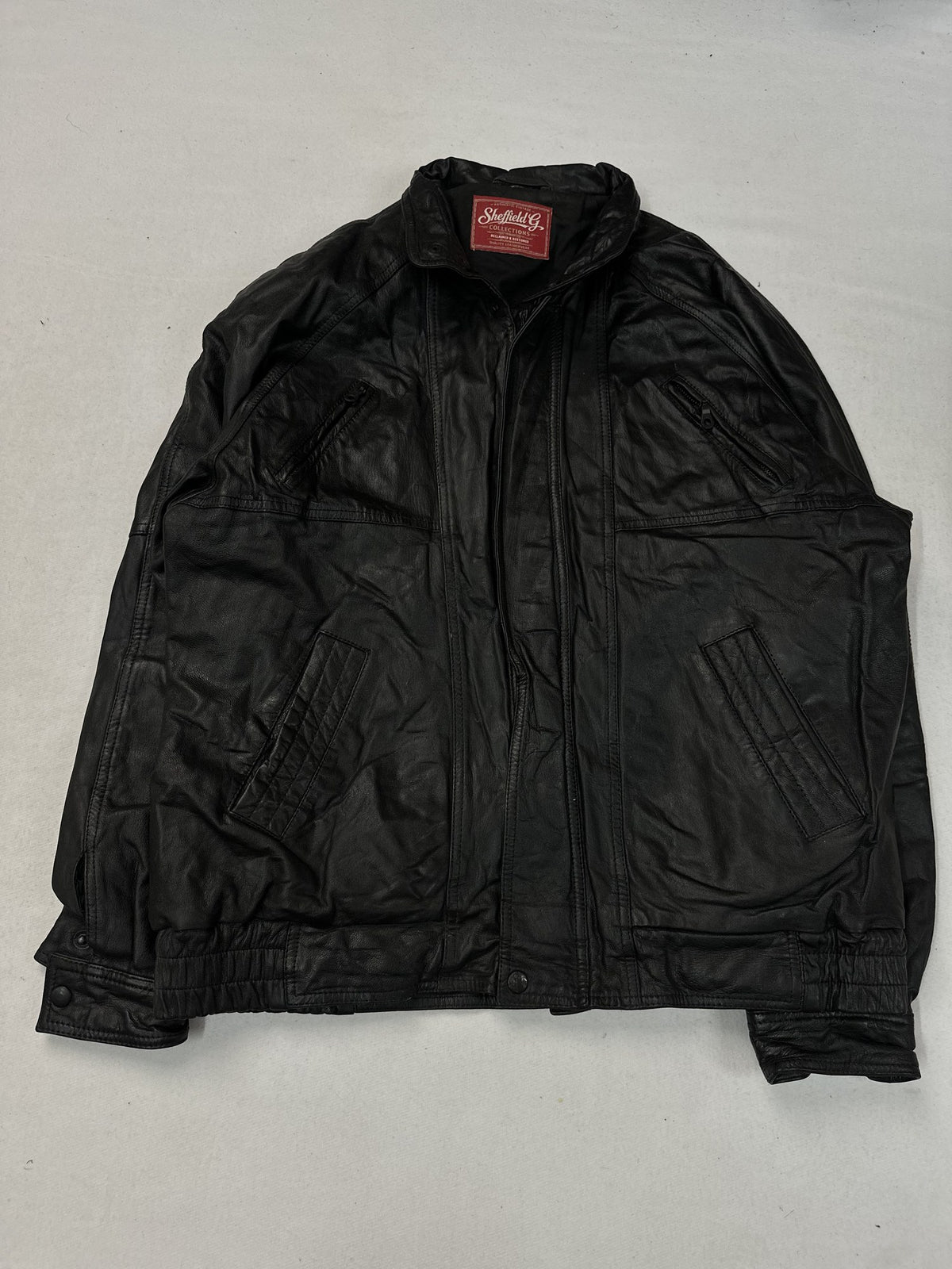 Black leather vintage jacket, size L - chest and pocket detail.